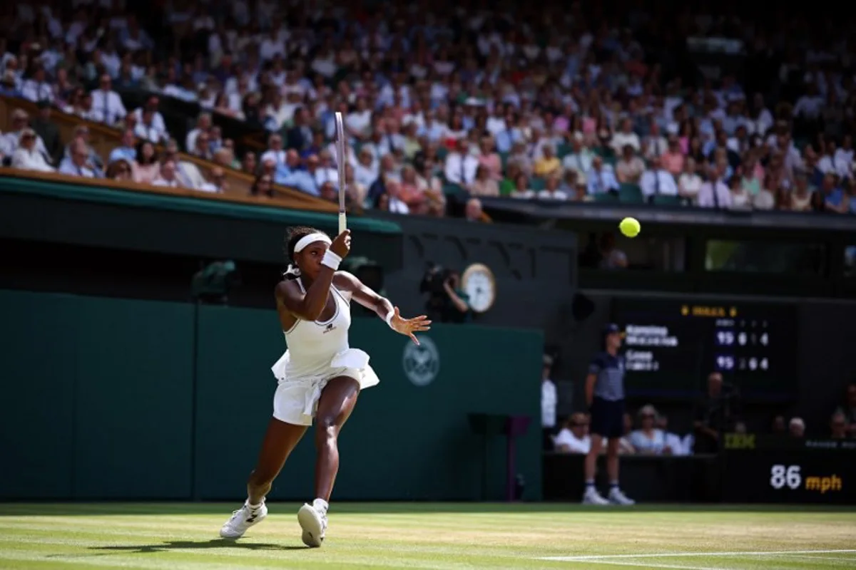 US player Coco Gauff returns to Czech Republic's Karolina Muchova during their women's singles semi-final tennis match on the eleventh day of the 2026 Wimbledon Championships at The All England Lawn Tennis and Croquet Club in Wimbledon, southwest London, on July 9, 2026.  Henry NICHOLLS / AFP
