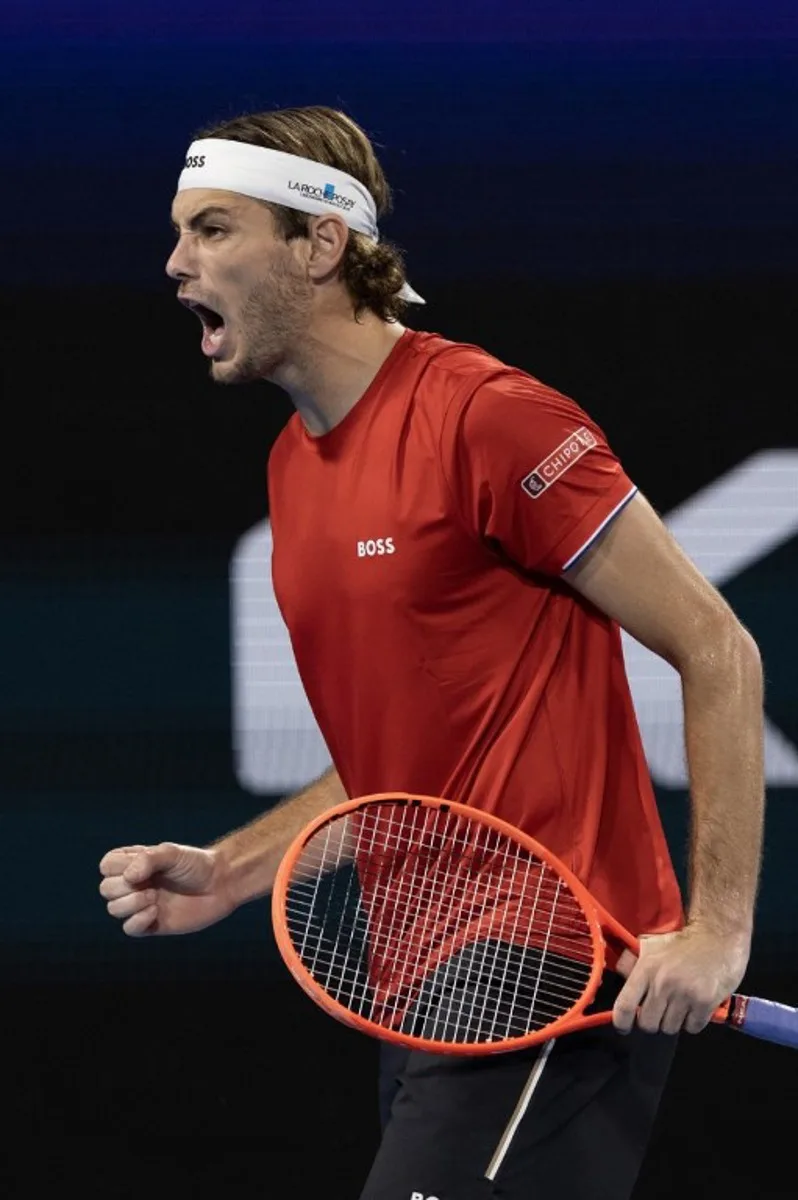 USA's Taylor Fritz reacts during his men's singles final match against Poland's Hubert Hurkacz at the United Cup tennis tournament on Ken Rosewall Arena in Sydney on January 5, 2025.  Steve CHRISTO / AFP