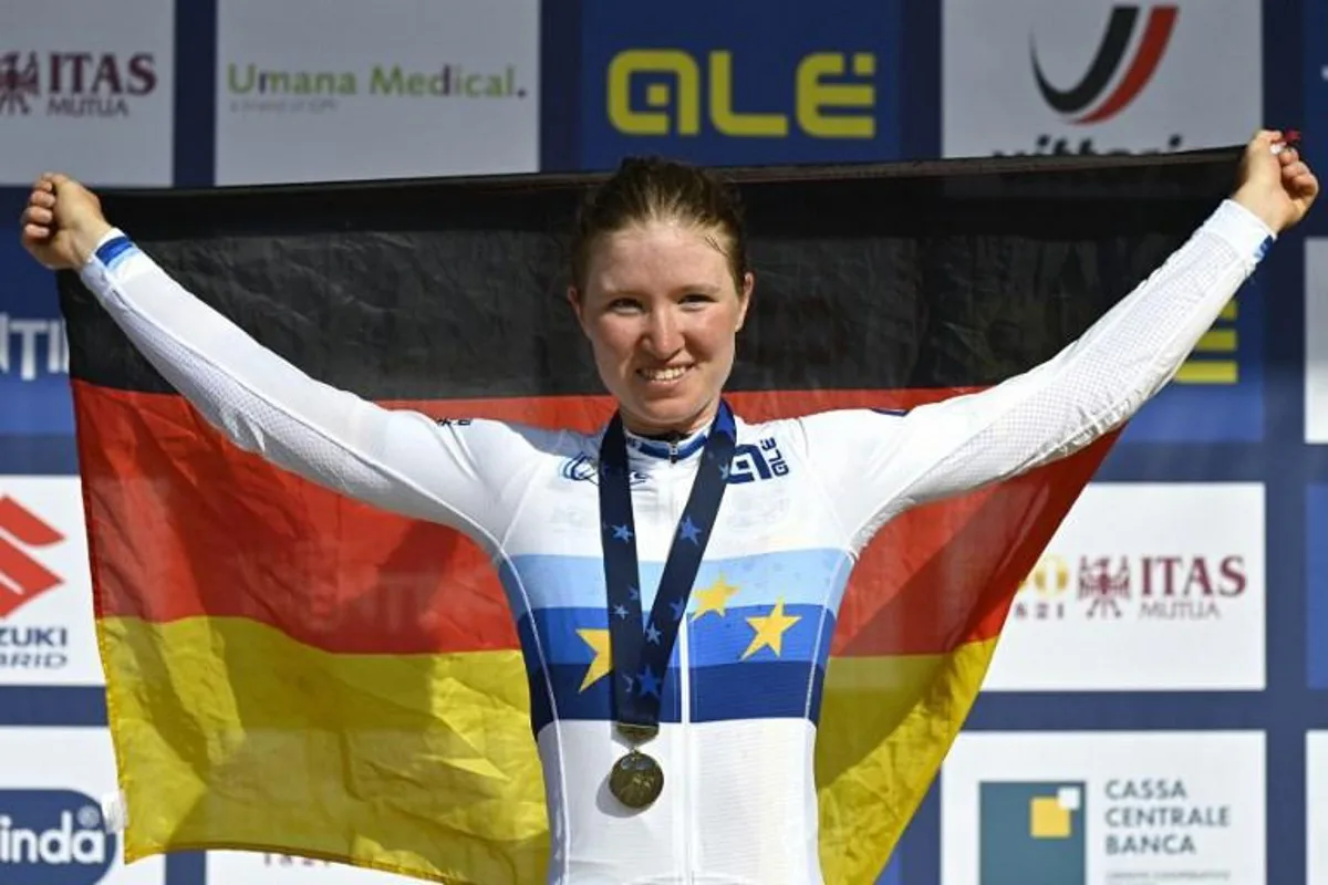 German cyclist Linda Riedmann celebrates on the podium after zinning the UEC European women junior road cycling championships in Trento on September 10, 2021. Alberto PIZZOLI / AFP