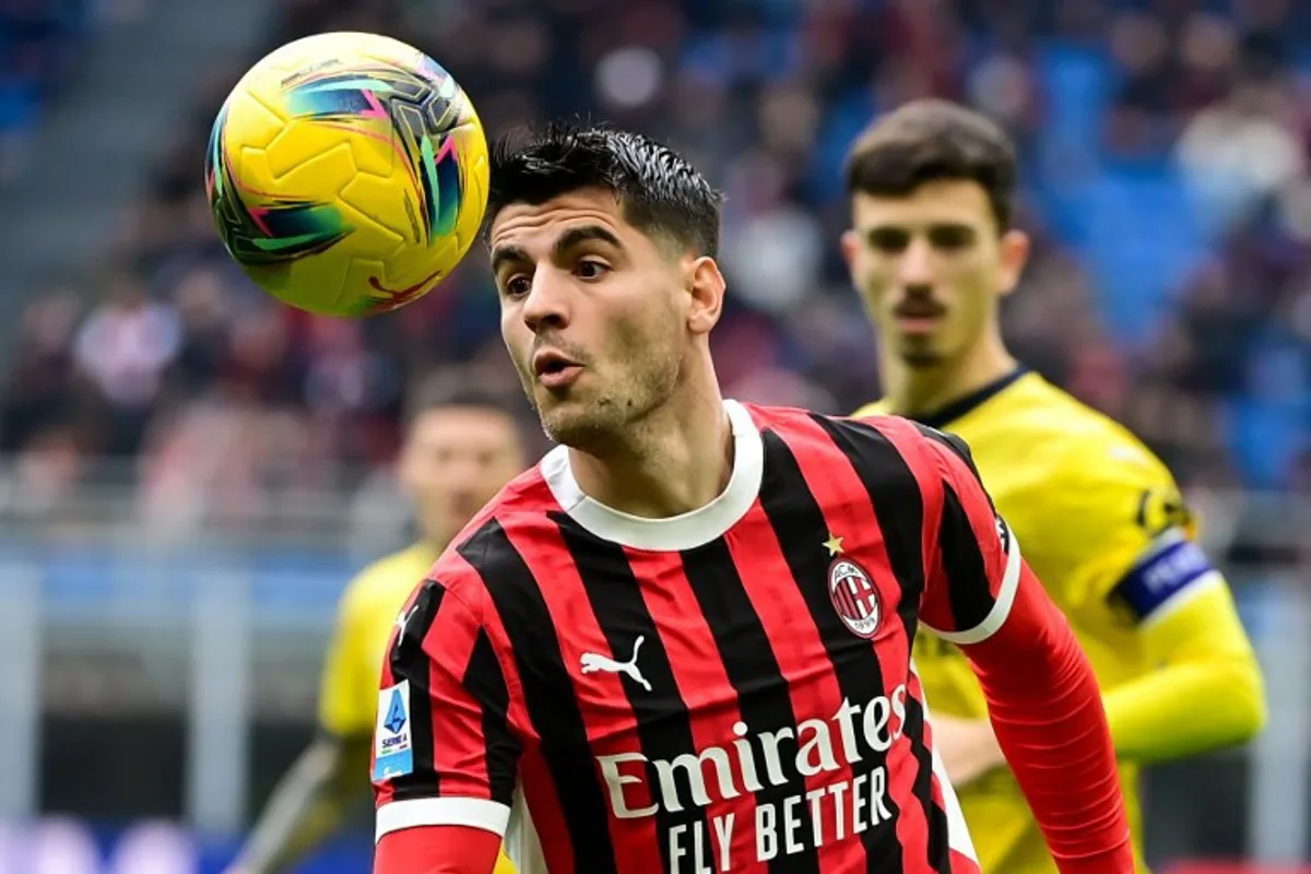 AC Milan's Spanish forward #7 Álvaro Morata heads the ball during the Italian Serie A football match between AC Milan and Parma at the San Siro Stadium in Milan, on January 26, 2025.  Piero CRUCIATTI / AFP