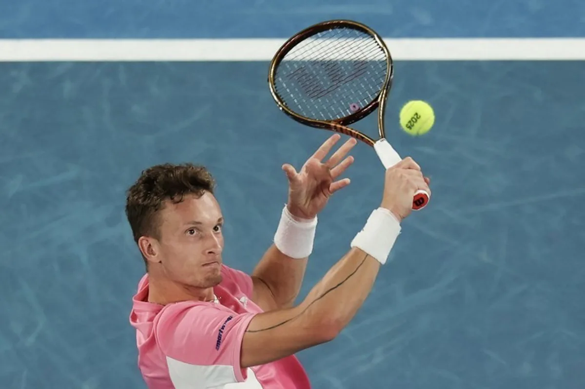 Czech Republic's Jiri Lehecka hits a return against Serbia's Novak Djokovic during their men's singles match on day eight of the Australian Open tennis tournament in Melbourne on January 19, 2025.  Adrian DENNIS / AFP