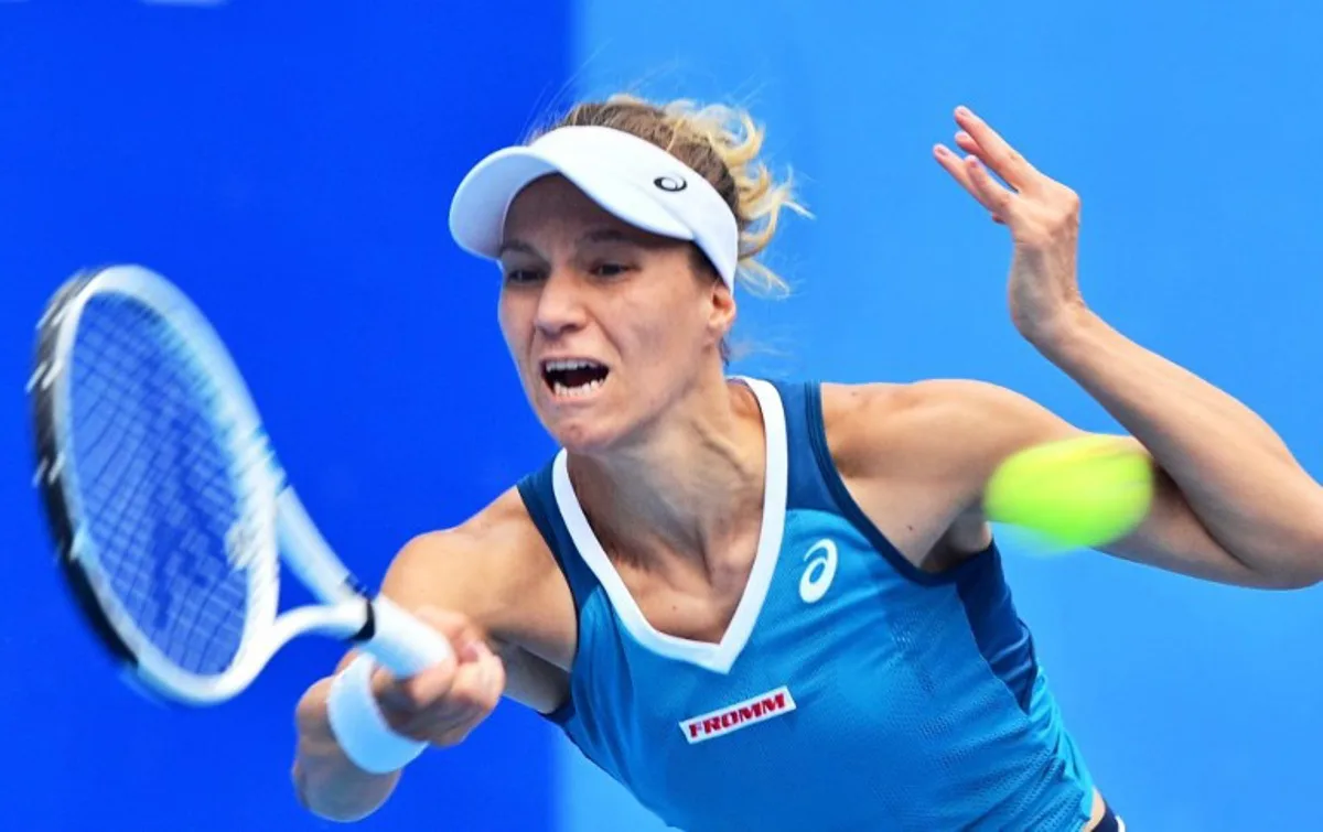 Switzerland's Viktorija Golubic hits a return to Arantxa Rus of the Netherlands during their women's singles quarter-final at the Jiangxi Open tennis tournament in Jiujiang, in China's central Jiangxi province on November 1, 2024.  AFP