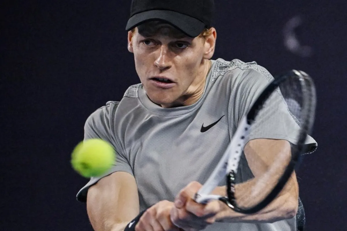 Italy's Jannik Sinner hits a return to Czech Republic's Jiri Lehecka during their men's singles quarter-final match at the China Open tennis tournament in Beijing on September 30, 2024.  GREG BAKER / AFP