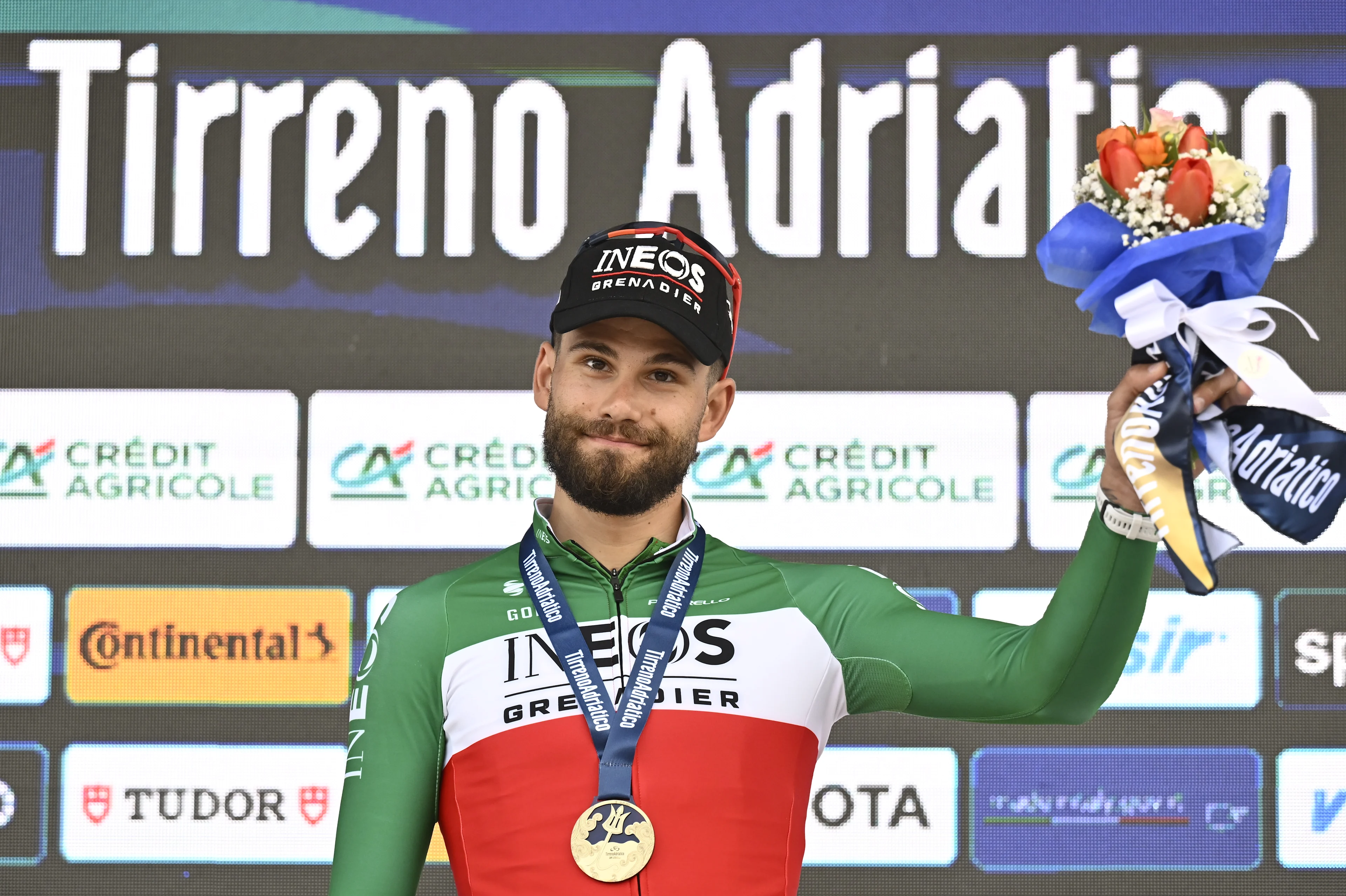 Italian Filippo Ganna of Ineos Grenadiers celebrates on the podium after winning the first stage of the Tirreno-Adriatico cycling race, a 11,5km individual time trial in Lido di Camaiore, Italy, Monday 10 March 2025. BELGA PHOTO DIRK WAEM