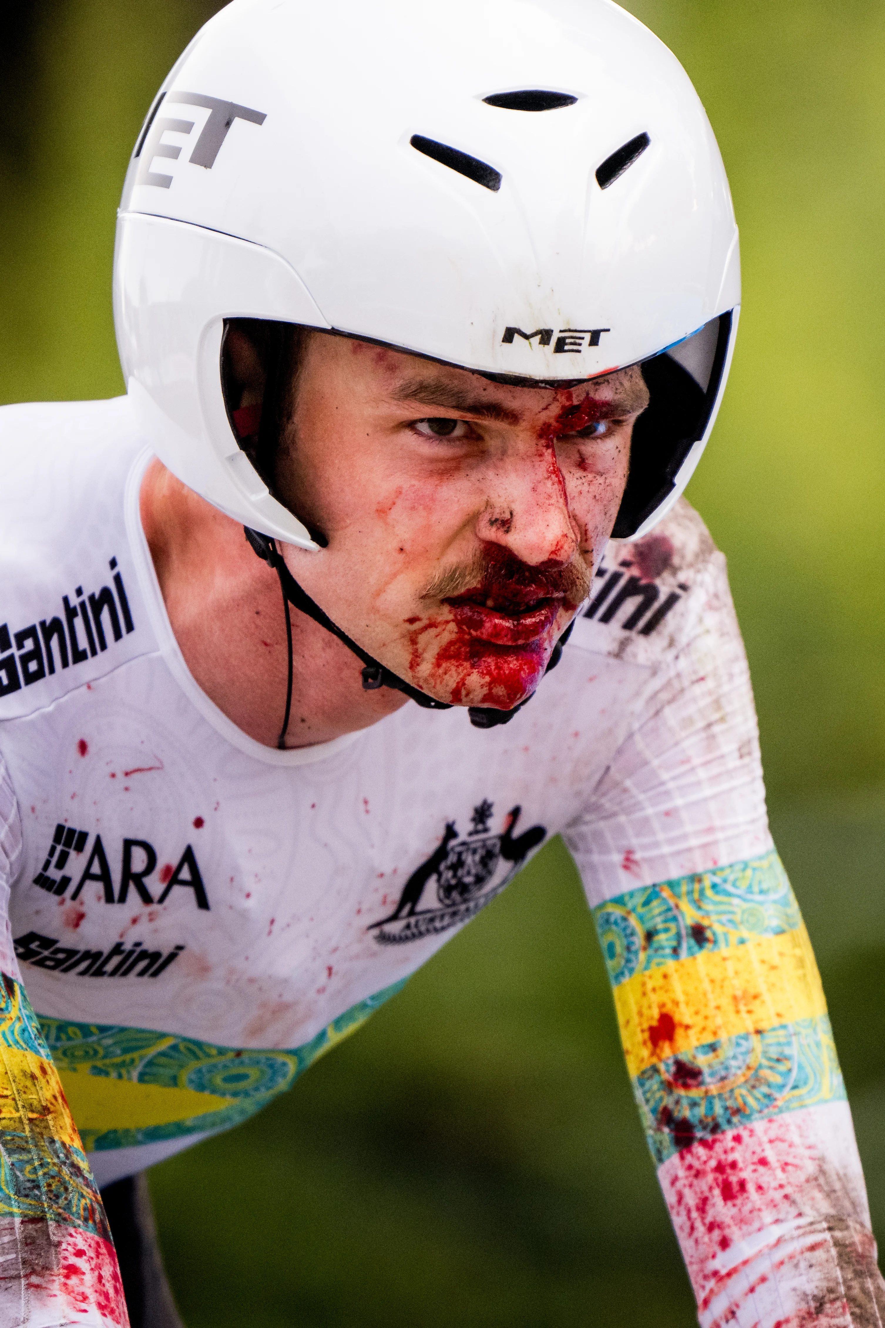 Australian Jay Vine of UAE Team Emirates cross the finish line with a lot of blood on his face after the men elite time trial race at the 2024 UCI Road and Para-Cycling Road World Championships, Sunday 22 September 2024, in Zurich, Switzerland. The Worlds are taking place from 21 to 29 September. BELGA PHOTO JASPER JACOBS