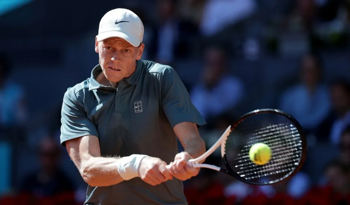 Italy's Jannik Sinner returns the ball to Denmark's Elmer Moller during their 2026 ATP Tour Madrid Open tennis tournament third round singles match at the Caja Magica in Madrid, on April 26, 2026.   Thomas COEX / AFP