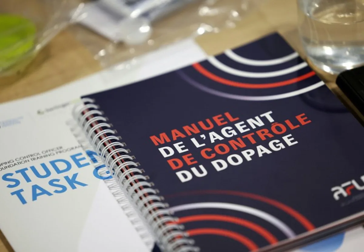 This photograph taken on April 22, 2023, shows a doping control officer's manual during a training for doping controllers for the Paris Olympic and Paralympic Games in Saint-Denis, north of Paris. These 33 trainees responded this winter to a classified ad from the International Control Agency (ICA), which manages the Olympic anti-doping program on behalf of the International Olympic Committee (IOC). FRANCK FIFE / AFP