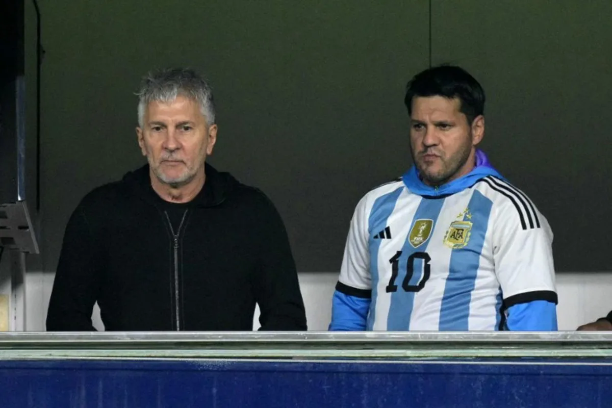Argentina's forward Lionel Messi's father, Jorge Messi (L), and brother Rodrigo wait for the start of the 2026 FIFA World Cup South American qualifiers football match between Argentina and Peru at the La Bombonera stadium in Buenos Aires on November 19, 2024. JUAN MABROMATA / AFP