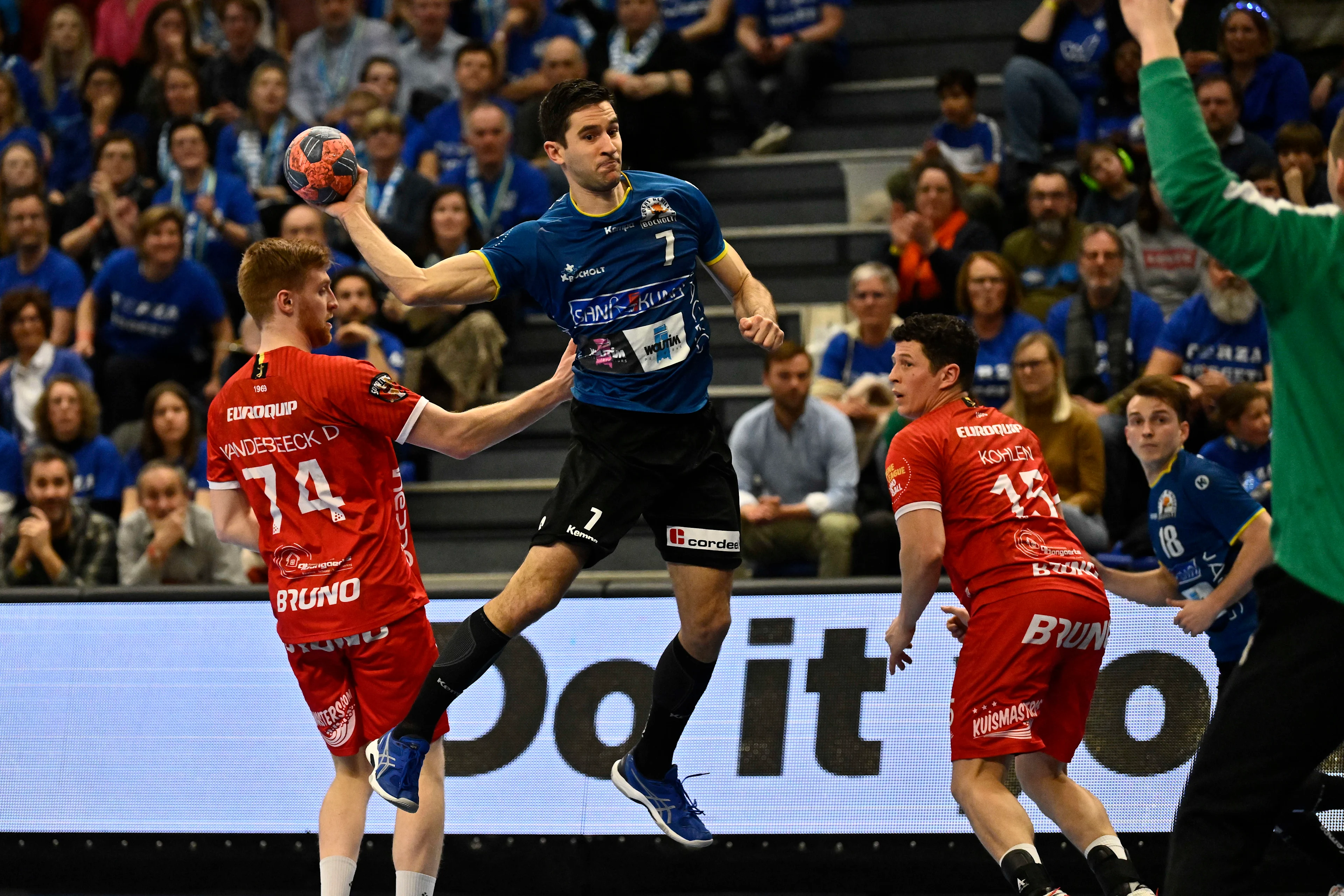 Pelt's Door Vandebeeck and Bocholt's Wout Winters fight for the ball during a game between Achilles Bocholt and Sporting Pelt, the men's final of the Belgian handball cup, Saturday 01 April 2023, in Hasselt. BELGA PHOTO JOHAN EYCKENS