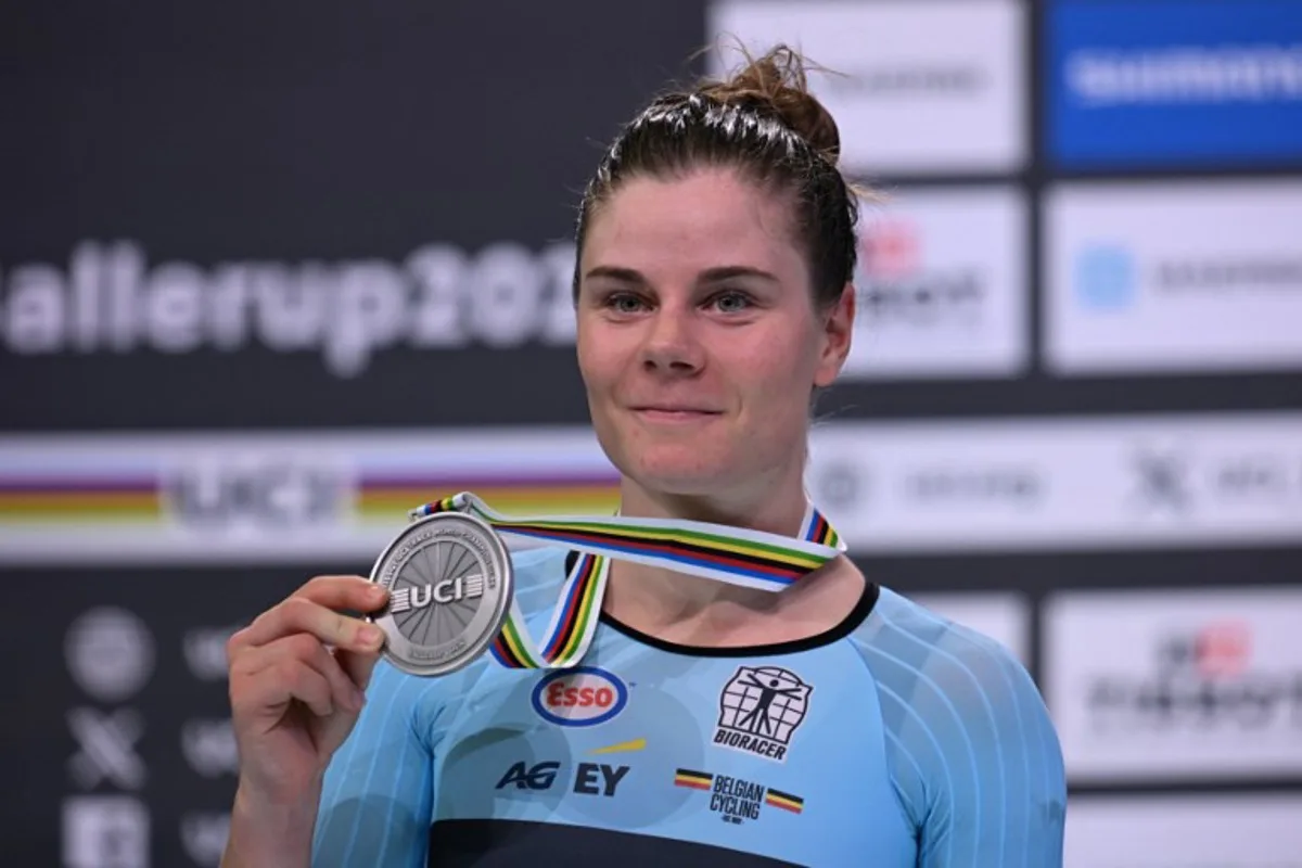 Second placed Belgium's Lotte Kopecky celebrates on the podium after the women's elimination race of the UCI Track Cycling World Championships in Ballerup, Denmark, on October 17, 2024. Jonathan NACKSTRAND / AFP