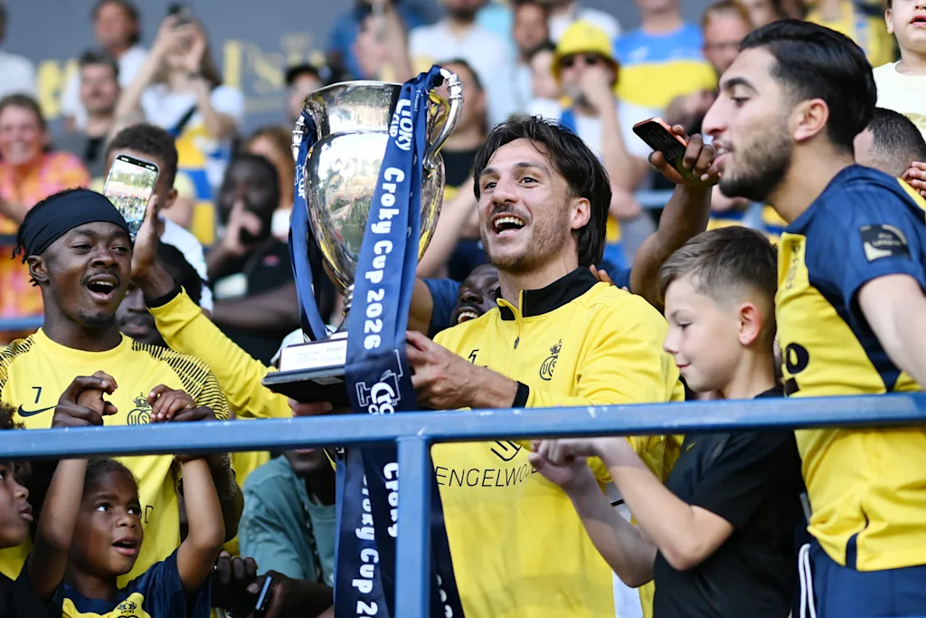 Union's Kevin Mac Allister celebrates with the Croky Cup after a soccer match between Royale Union Saint-Gilloise and RSC Anderlecht, Sunday 24 May 2026 in Brussels, on the last day of the Champion's Play-offs of the 2025-2026 'Jupiler Pro League' first division of the Belgian championship. BELGA PHOTO MAARTEN STRAETEMANS