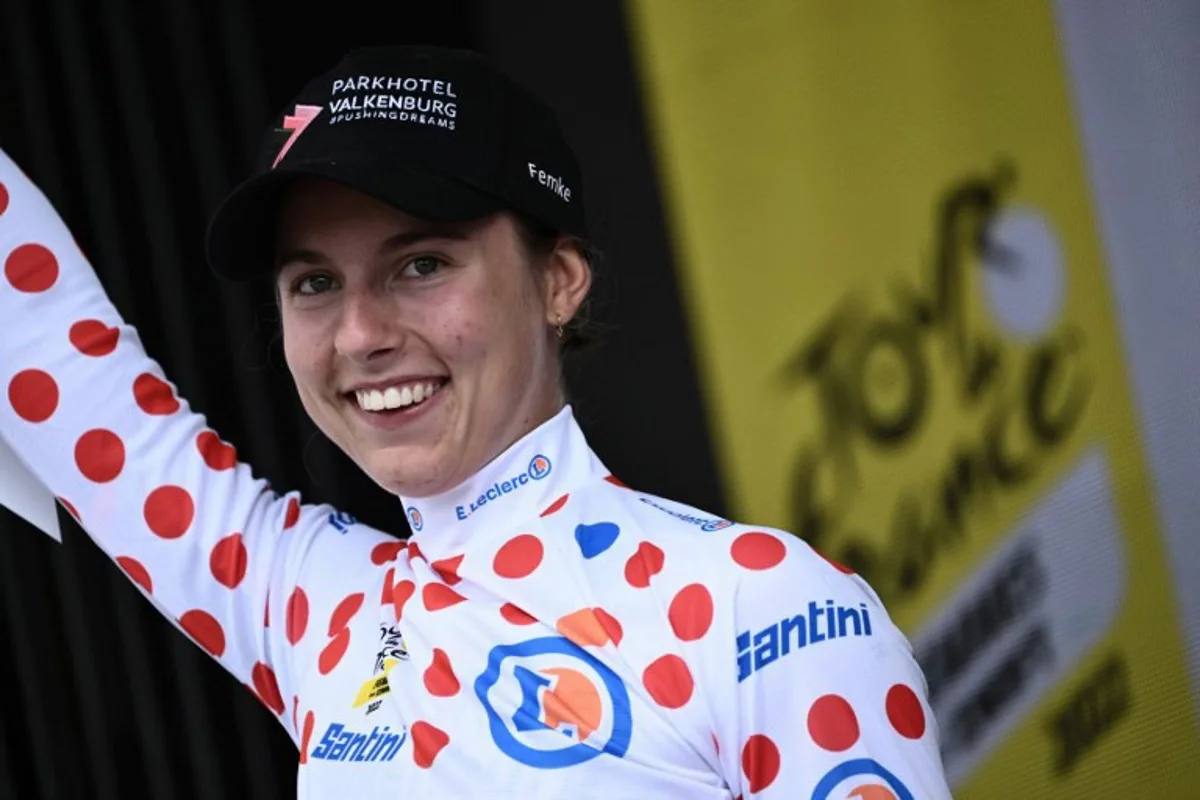 Parkhotel Valekenburg's Dutch rider Femke Gerritse celebrates her best climber's polka dot jersey on the podium at the end of the 3rd stage of the new edition of the Women's Tour de France cycling race, 133,6 km between Reims and Epernay on July 26, 2022.  Jeff PACHOUD / AFP