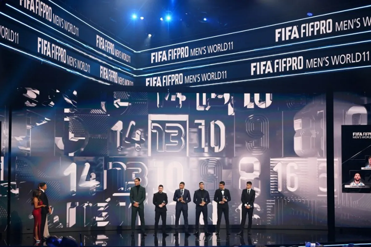 (From L) Netherlands and Liverpool defender Virgil van Dijk, Argentina and Paris Saint-Germain forward Lionel Messi, France and Paris Saint-Germain forward Kylian Mbappe, Morocco and Paris Saint-Germain defender Achraf Hakimi, Brazil and Manchester United midfielder Casemiro and Portugal and bayern Munich defender Joao Cancelo pose on stage as they receive awards for the FIFA FIFPRO men's World11 during the Best FIFA Football Awards 2022 ceremony in Paris on February 27, 2023.  FRANCK FIFE / AFP