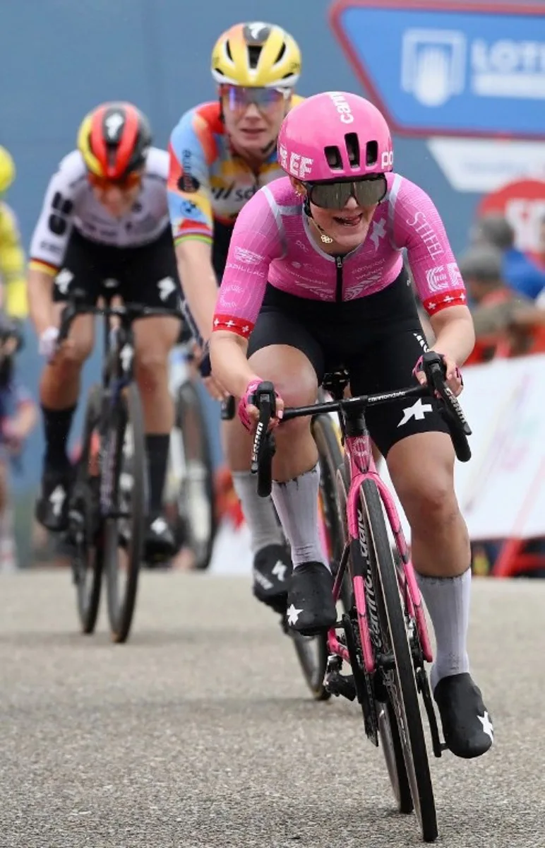 Team EF Education - Cannondale's Swiss rider Noemi Ruegg arrives at the finish in first place followed by Team Boels - Dolmans Cyclingteam's Belgian rider Lotte Kopecky and Team FDJ - SUEZ's German rider Franziska Koch, at the end of the first stage of the 2026 La Vuelta Femenina cycling tour of Spain, a 113.9 km race between Marin and Salvaterra do Mino, on May 3, 2026.   Miguel RIOPA / AFP