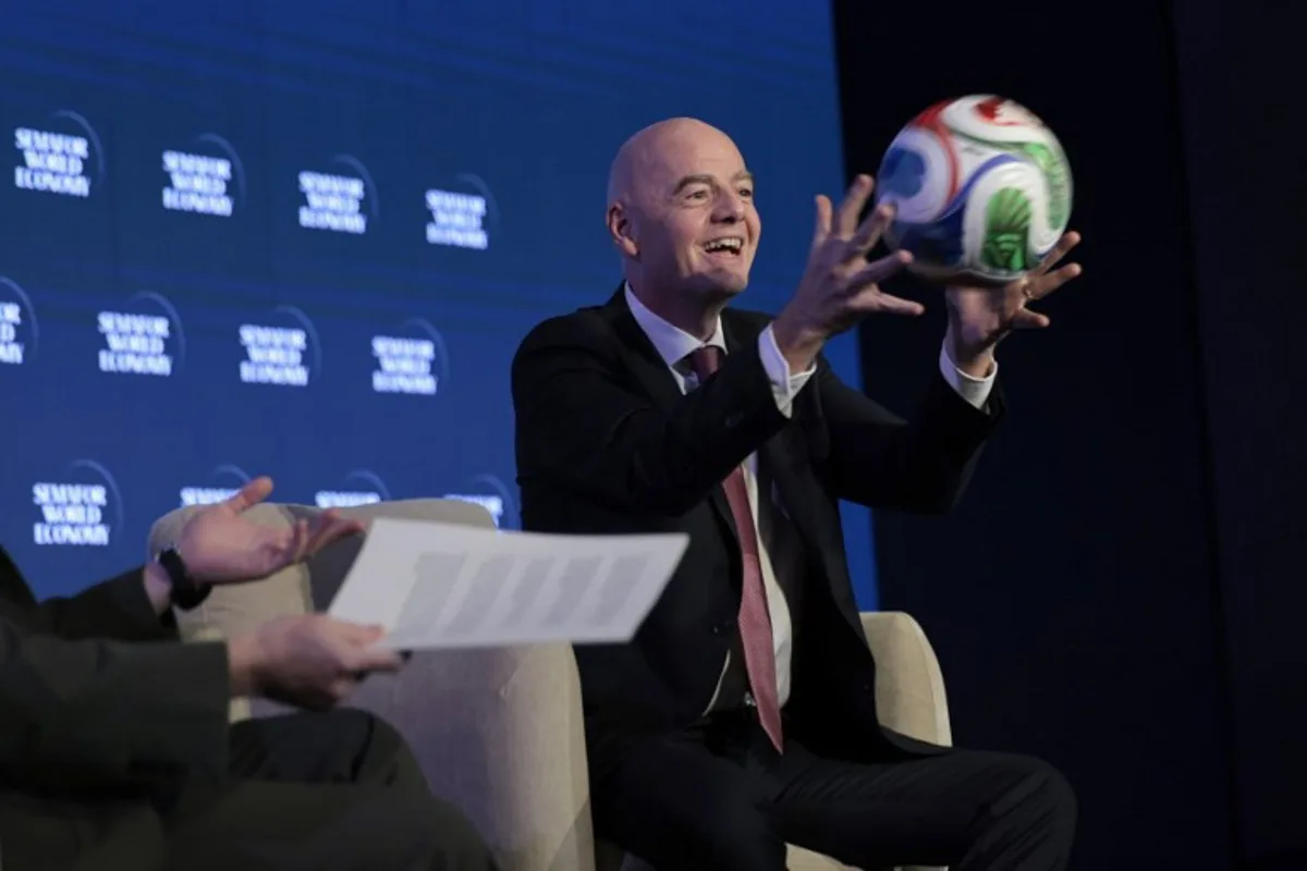 FIFA President Gianni Infantino juggles a foootball while speaking during the 2026 Semafor World Economy conference in Washington, DC, on April 15, 2026.  Kent NISHIMURA / AFP