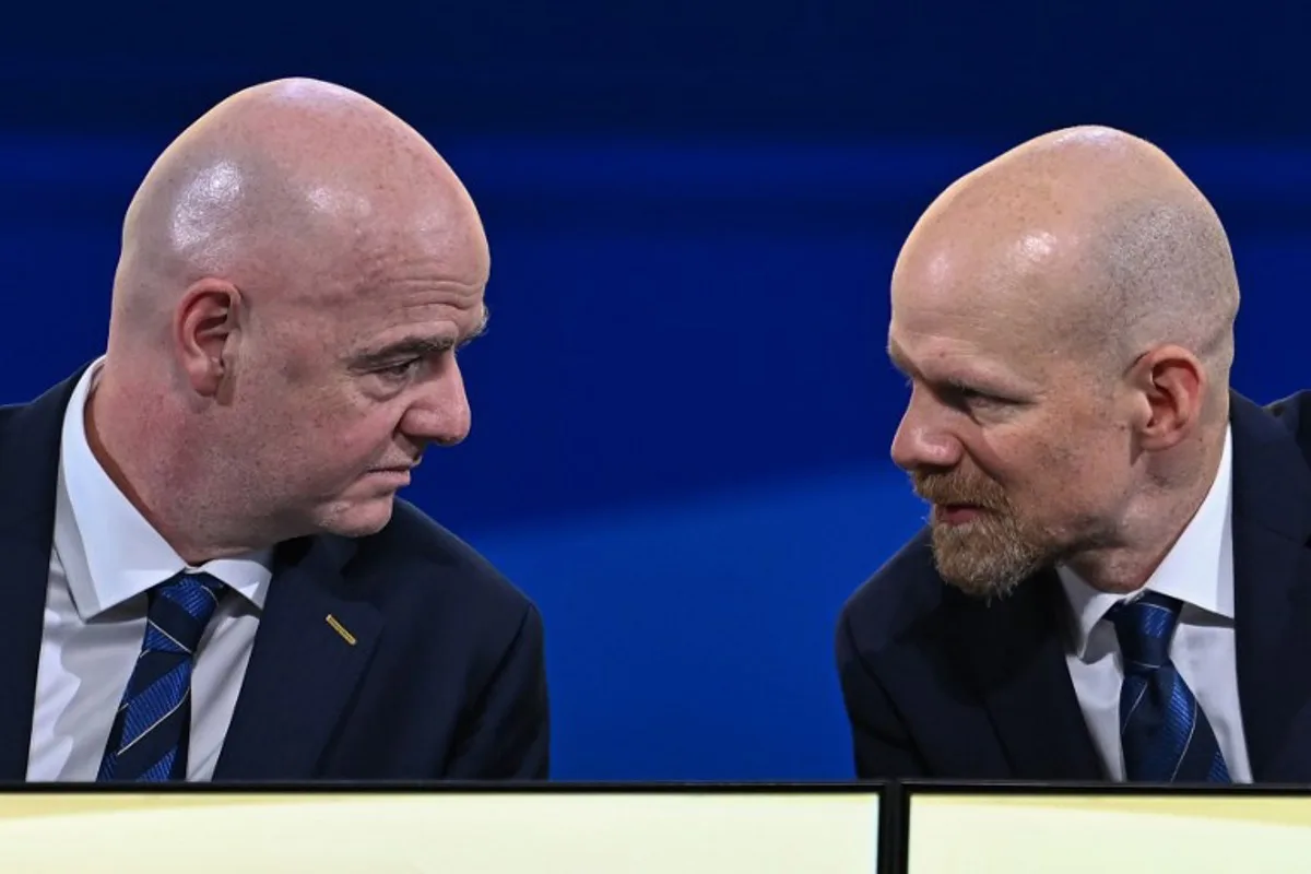 FIFA President Gianni Infantino (L) speaks with FIFA Secretary-General Mattias Grafstrom (R) during the 74th FIFA Congress in Bangkok on May 17, 2024. The 74th FIFA Congress is taking place in Bangkok with member associations voting on a range of issues including confirmation of the host nation or nations for the 2027 women's football World Cup. Manan VATSYAYANA / AFP