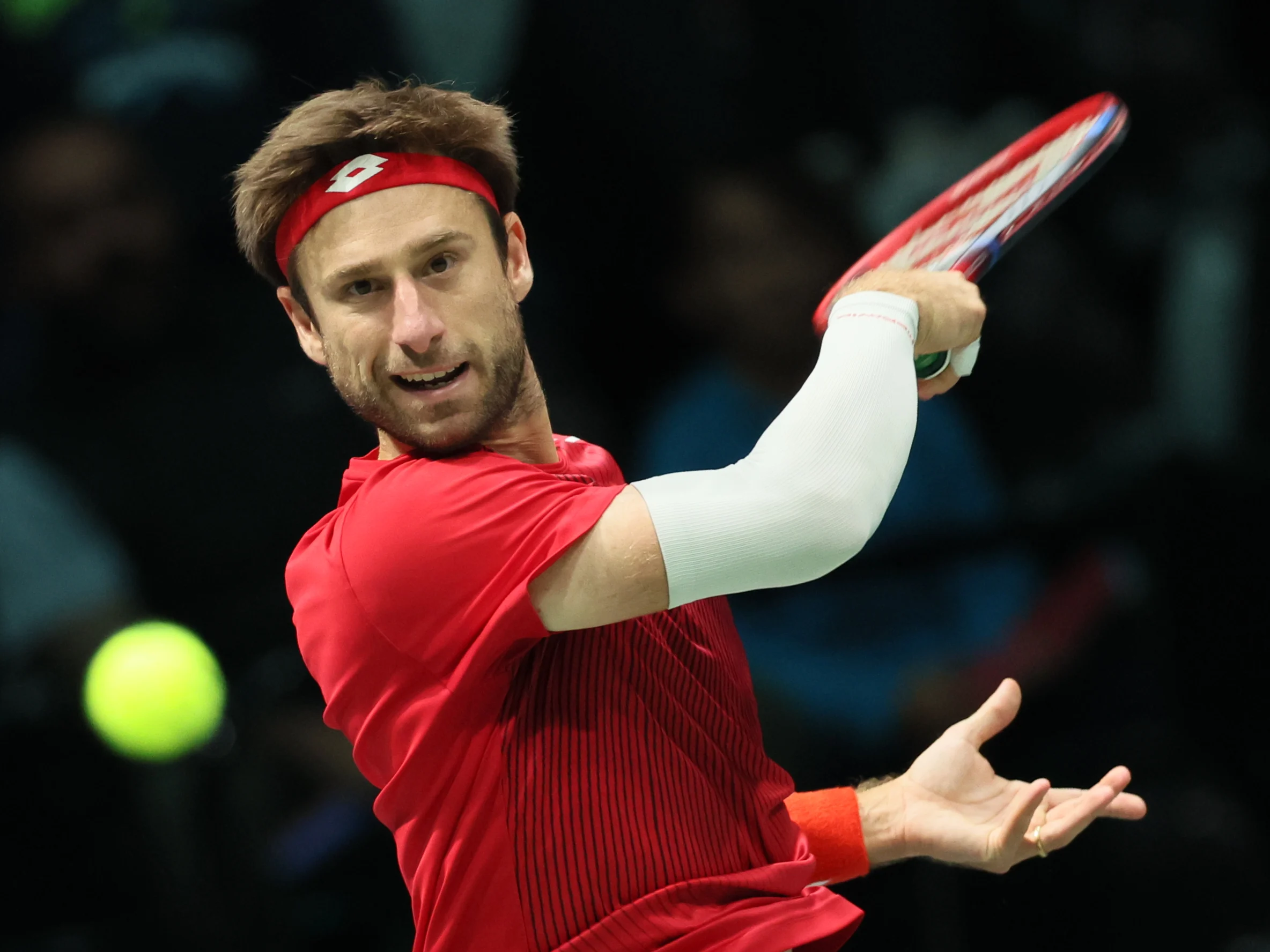 Belgian Sander Gille serves at a double game between Italian pair Bolelli/Vavassori and Belgian pair Gille/ Vliegen, the third match in the group A Davis Cup Finals group stage between Italy and Belgium, Friday 13 September 2024, at the Unipol Arena, in Bologna, Italy. BELGA PHOTO BENOIT DOPPAGNE