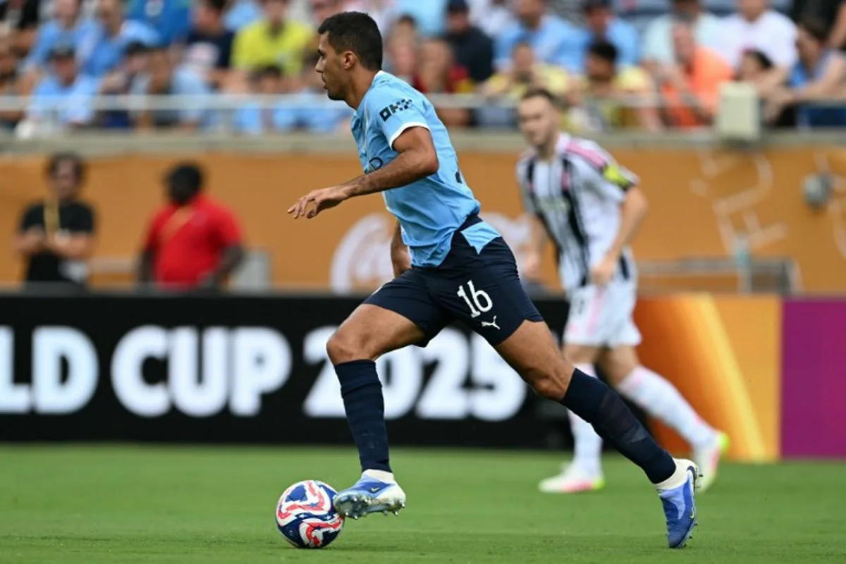 Manchester City's Spanish midfielder #16 Rodri runs with the ball during the FIFA Club World Cup 2025 Group D football match between Italy's Juventus and England's Manchester City at the Camping World stadium in Orlando on June 26, 2025. Chandan KHANNA / AFP
