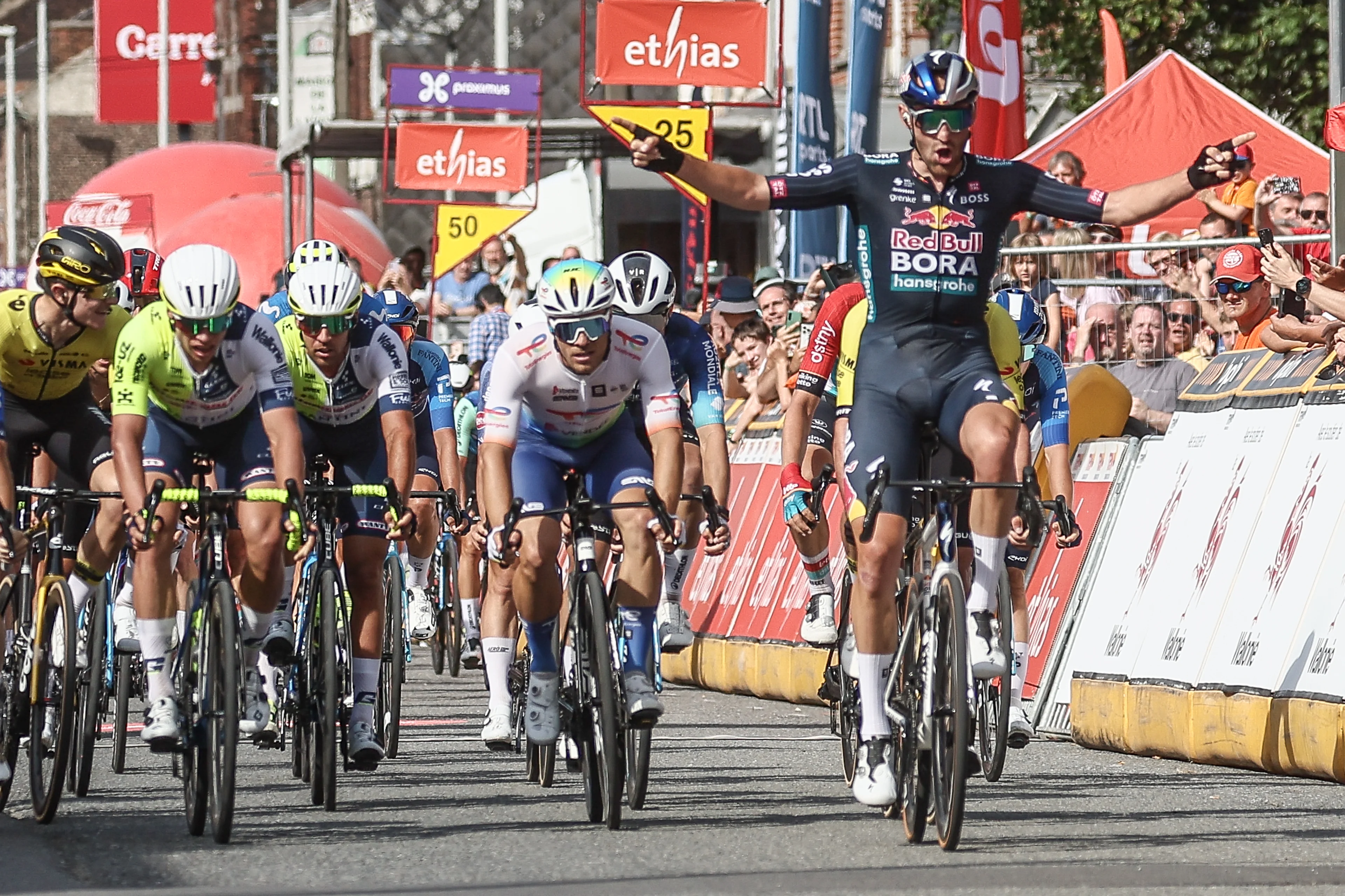 Belgian Jordi Meeus of Red Bull-Bora-Hansgrohe celebrates as he crosses the finish line to win stage 1 of the Tour De Wallonie cycling race, from Tournai to Fleurus (178,6 km), Monday 22 July 2024. This year's Tour de Wallonie takes place from 22 to 26 July 2023. BELGA PHOTO BRUNO FAHY