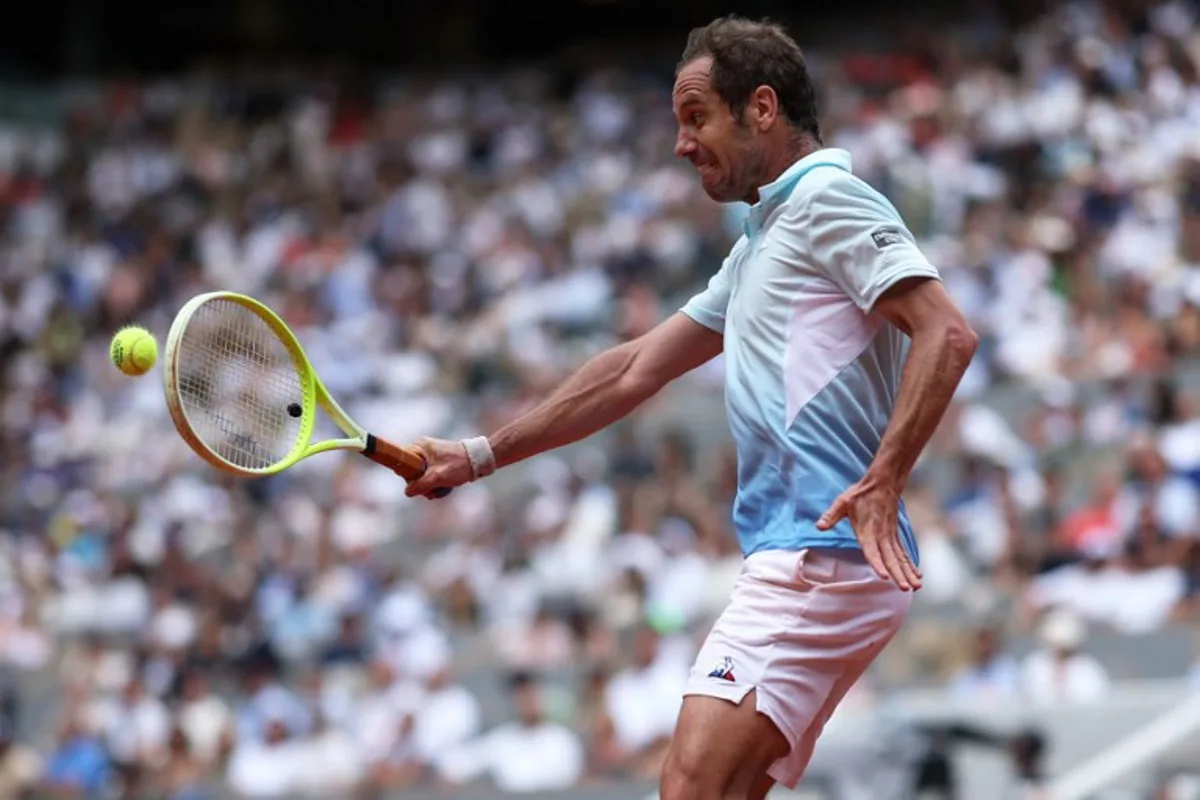 France's Richard Gasquet plays a backhand return to Italy's Jannik Sinner during their men's singles match on day 5 of the French Open tennis tournament on Court Philippe-Chatrier at the Roland-Garros Complex in Paris on May 29, 2025. ALAIN JOCARD / AFP