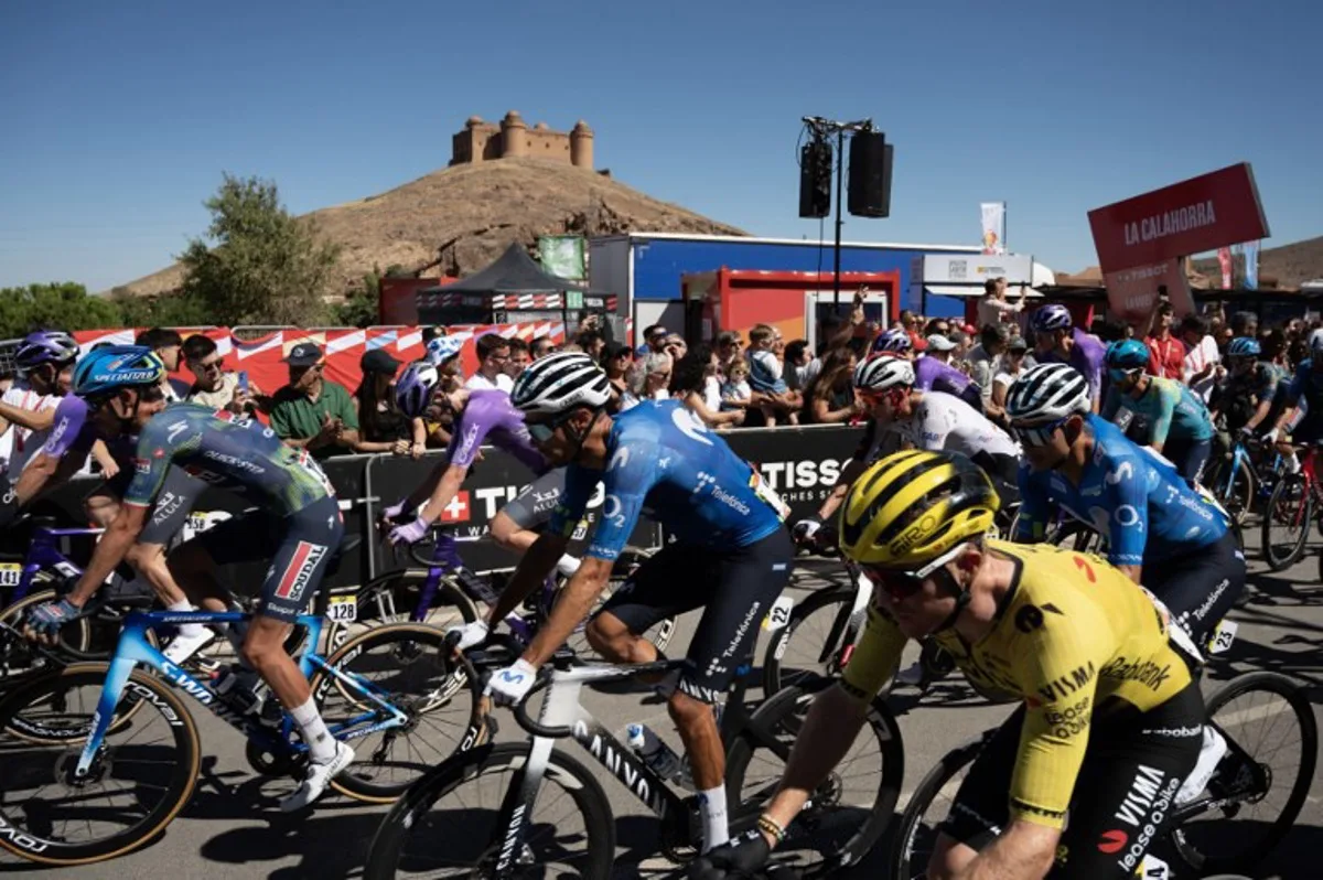 Cyclists ride at the start of the 20th stage of the Vuelta a Espana 2026 cycling tour, a 186,8 km race between La Calahorra and Collado del Alguacil, on September 12, 2026.   JORGE GUERRERO / AFP