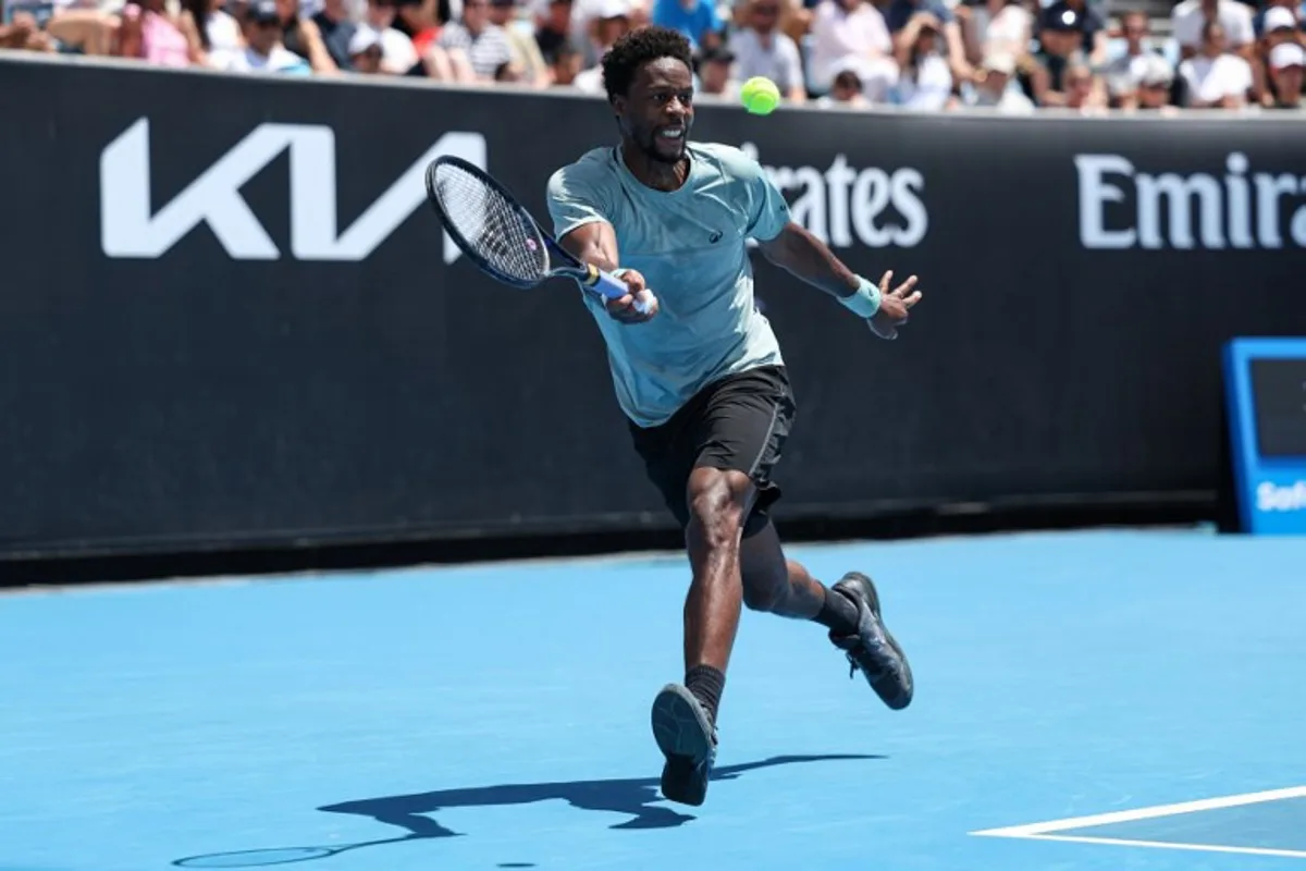 France's Gael Monfils hits a return against Germany's Daniel Altmaier during their men's singles match on day five of the Australian Open tennis tournament in Melbourne on January 16, 2025.  Martin KEEP / AFP