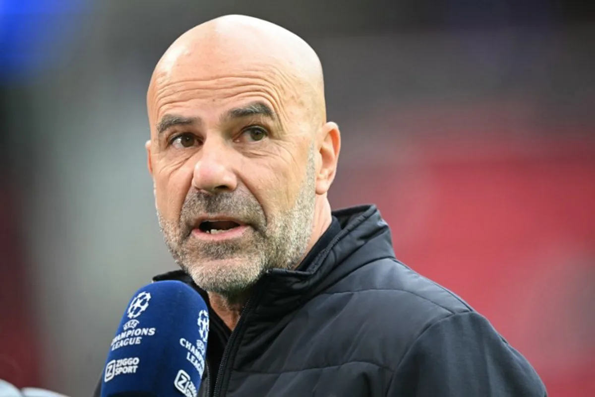 PSV Eindhoven's Dutch coach Peter Bosz speaks to the media before the start of the UEFA Champions League first round day 1 football match between PSV Eindhoven and Union Saint-Gilloise at the Philips Stadium, in Eindhoven on September 16, 2025. NICOLAS TUCAT / AFP