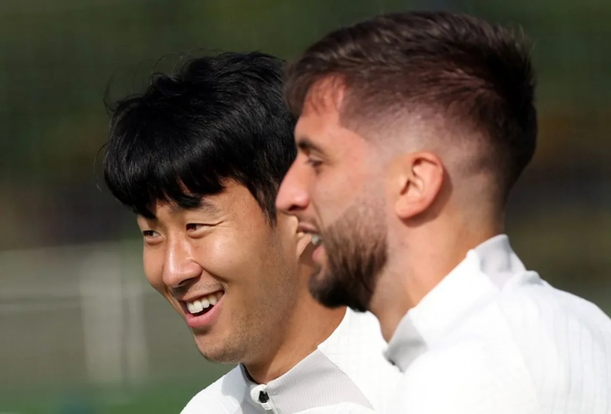 Tottenham Hotspur's South Korean striker Son Heung-Min (L) and Tottenham Hotspur's Uruguayan midfielder Rodrigo Bentancur attend a team training session at Tottenham Hotspur Football Club Training Ground in north London on October 3, 2022 on the eve of their UEFA Champions League Group D football match against Eintracht Frankfurt.  Adrian DENNIS / AFP