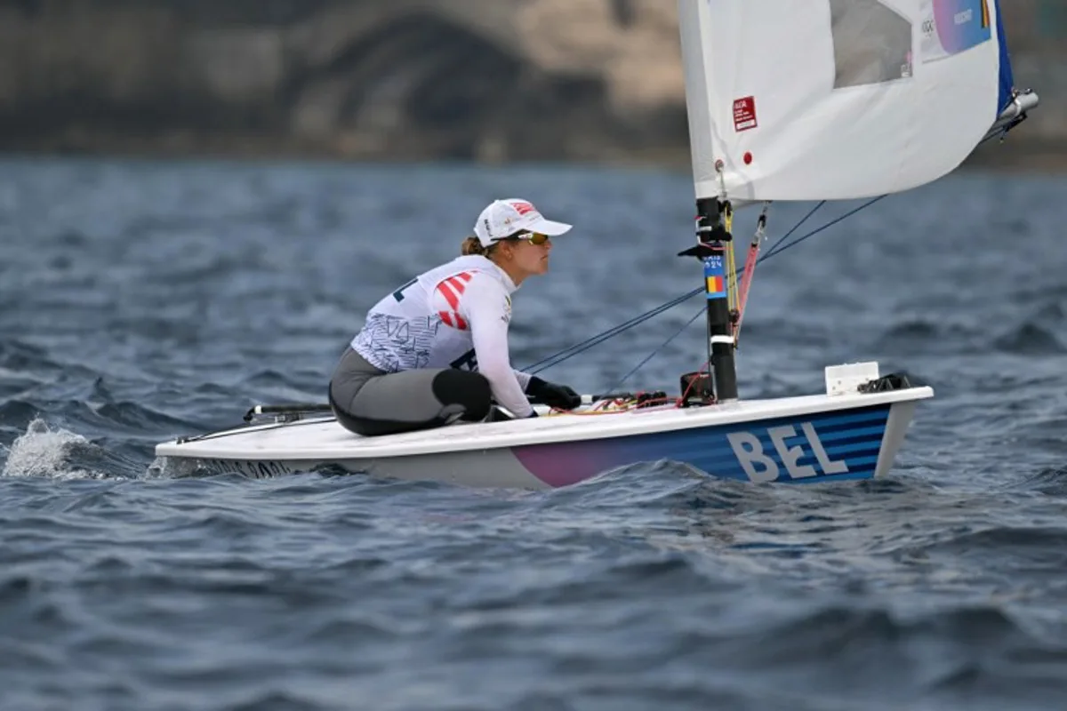Belgium's Emma Plasschaert prepares for the medal race of the women's ILCA 6 single-handed dinghy event during the Paris 2024 Olympic Games sailing competition at the Roucas-Blanc Marina in Marseille on August 7, 2024.   NICOLAS TUCAT / AFP