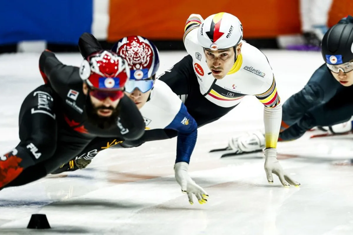 Belgium's Stijn Desmet (2nd R) competes during the 1000 meters men's quarter-final for the World Short Track Championships in Ahoy's Sport Hall in Rotterdam on March 17, 2024.  Iris van den Broek / ANP / AFP