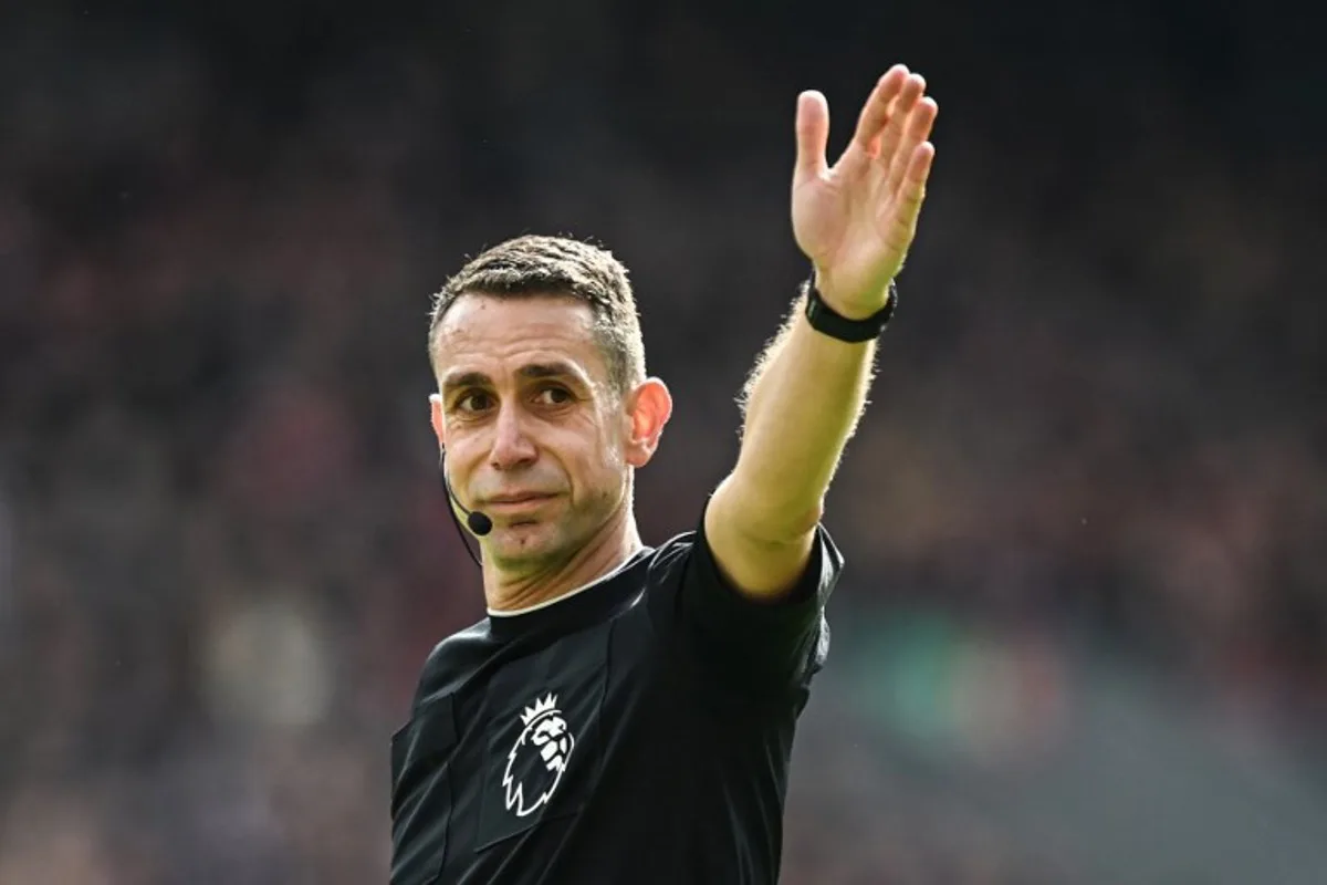 Referee David Coote gestures during the English Premier League football match between Liverpool and Brighton and Hove Albion at Anfield in Liverpool, north west England on March 31, 2024.  Paul ELLIS / AFP