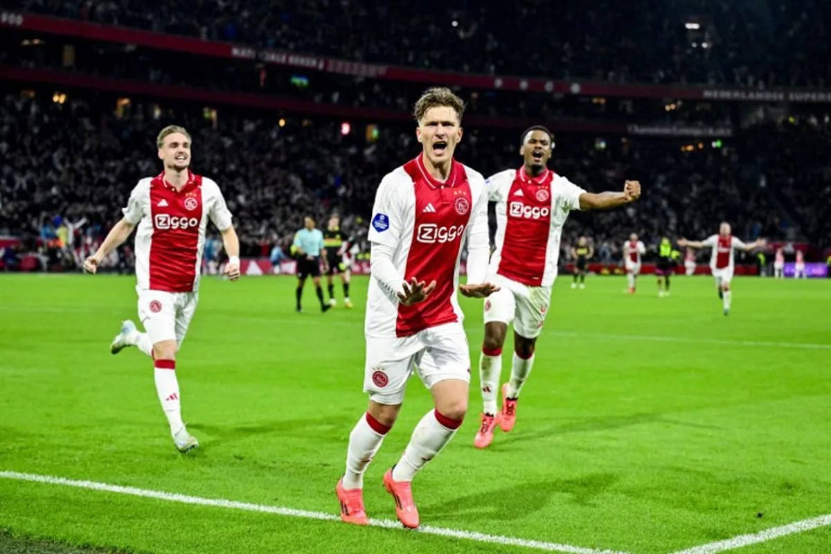 Ajax's Mika Godts celebrates after scoring a goal during the Dutch Eredivisie football match between Ajax Amsterdam and PSV Eindhoven at the Johan Cruijff ArenA on November 2, 2024 in Amsterdam.  Olaf Kraak / ANP / AFP