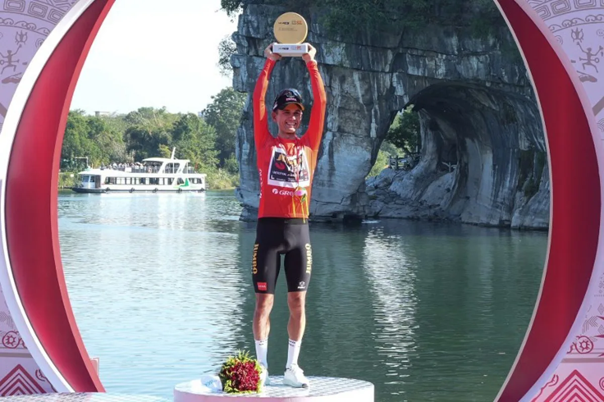 This photo taken on October 17, 2023 shows Netherlands' Milan Vader celebrating on the podium after winning the Tour of Guangxi cycling race in Guilin, in China's southern Guangxi region.  STR / AFP