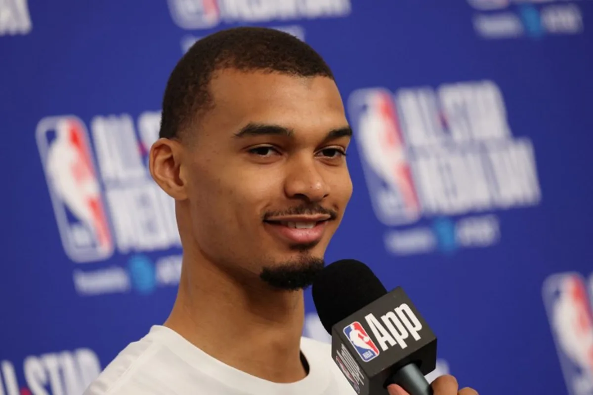 French basketball player Victor Wembanyama of the San Antonio Spurs speaks to the media during the NBA All-Star media day at the Intuit Dome in Inglewood, California, on February 14, 2026. Patrick T. Fallon / AFP