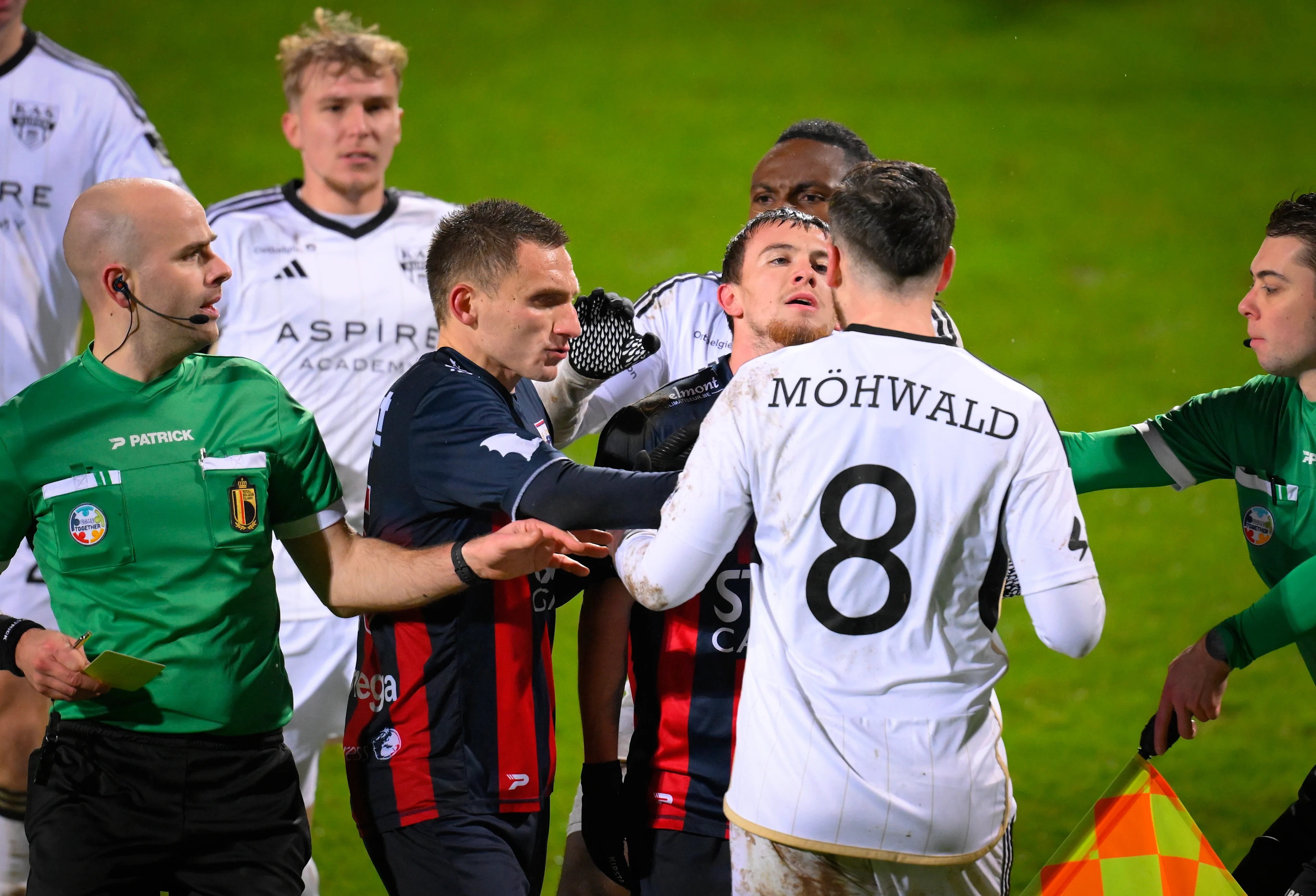 Liege's Alexis Lefebvre, Liege's Theo Pierrot and Eupen's Kevin Mohwald react during a soccer match between KAS Eupen and RFC Liege, in Eupen, on day 16 of the 2024-2025 'Challenger Pro League' 1B second division of the Belgian championship, Saturday 21 December 2024. BELGA PHOTO JOHN THYS