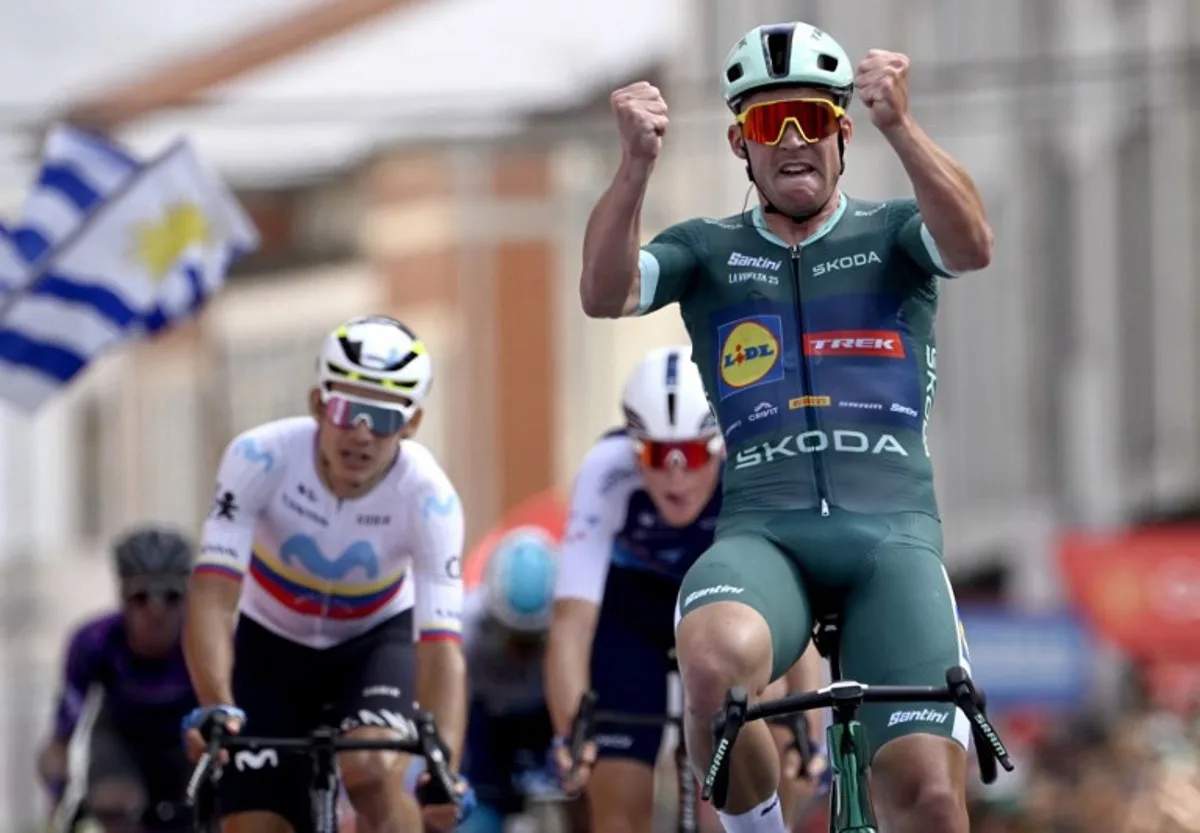 Team Lidl-Trek's Danish rider Mads Pedersen celebrates crossing first the finish line during the 15th stage of the Vuelta a Espana cycling tour, a 167 km race between A Veiga/Vegaredo and Monforte de Lemos, on September 7, 2025. Miguel RIOPA / AFP