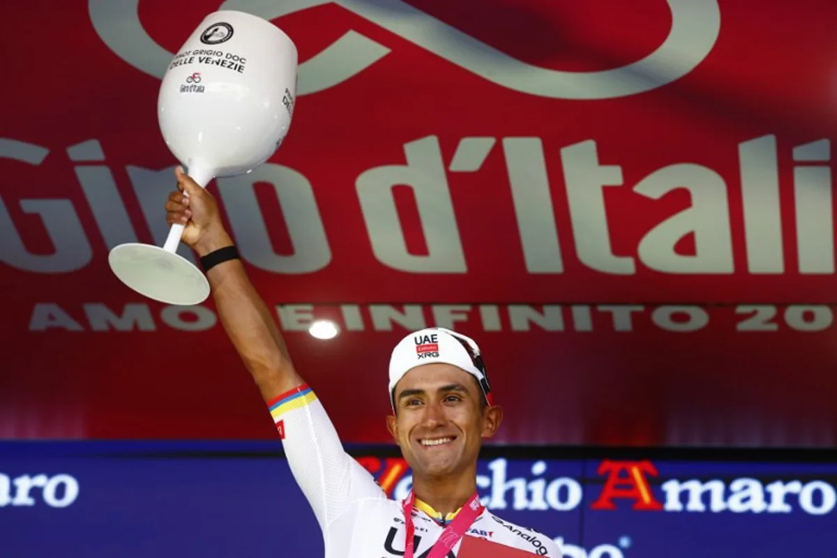 UAE Team Emirates - XRG Ecuadorian rider Jhonatan Narvaez poses on the podium after winning the 4th stage of the Giro d'Italia 2026 - Tour of Italy cycling race between Catanzaro and Cosenza, Italy, on May 12, 2026. Luca Bettini / AFP