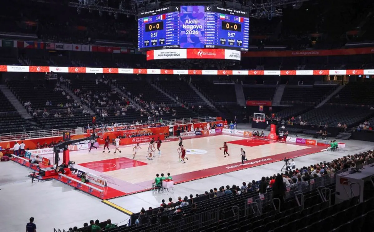 This general view shows players competing in the men's basketball Group B game between Iran and Qatar during the 2026 Asian Games in Nagoya on September 10, 2026.  STR / JIJI PRESS / AFP