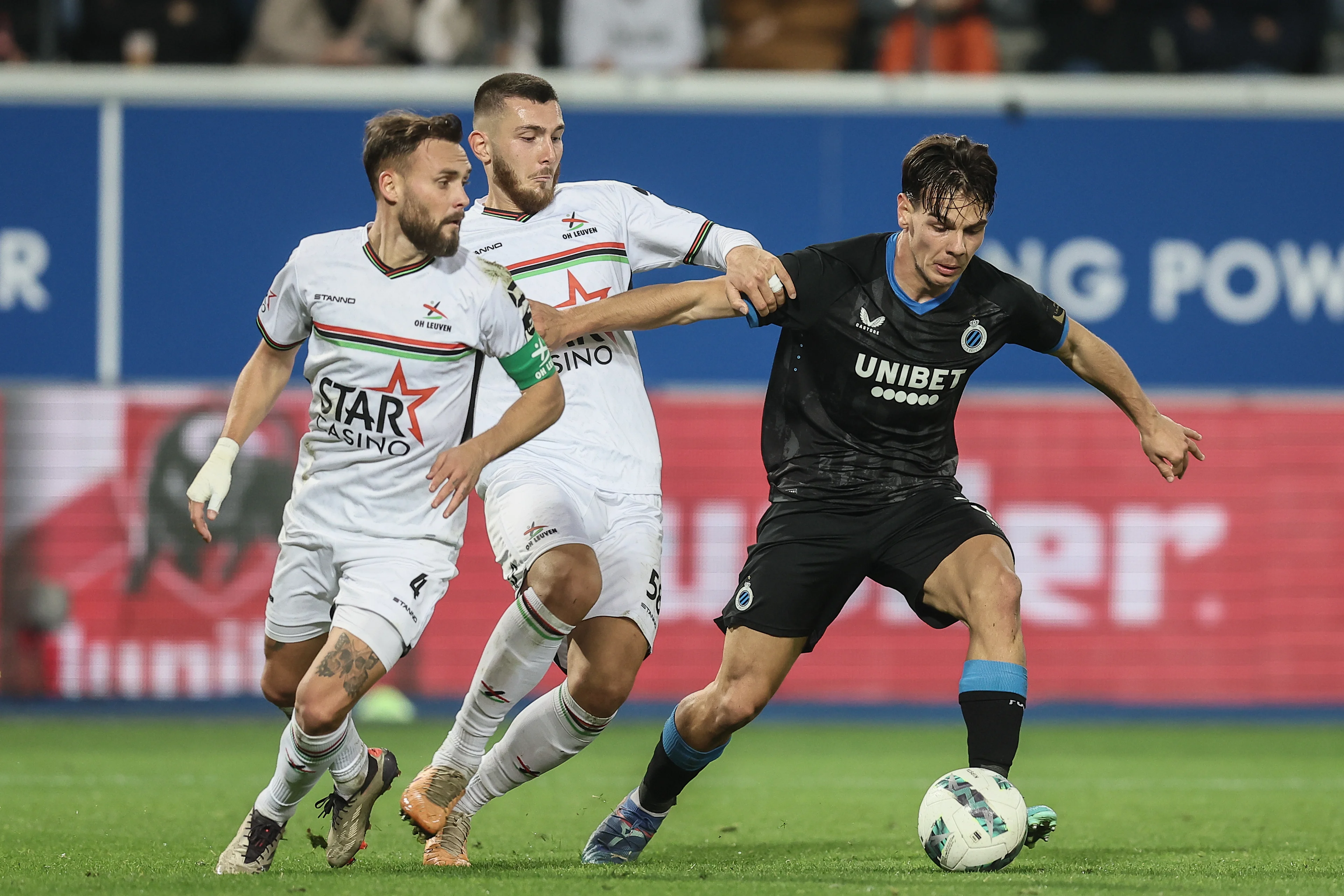 OHL's Birger Verstraete, OHL's Hasan Kurucay and Club's Ardon Jashari fight for the ball during a soccer match between Oud-Heverlee Leuven and Club Brugge KV, Saturday 02 November 2024 in Leuven, on day 13 of the 2024-2025 season of the 'Jupiler Pro League' first division of the Belgian championship. BELGA PHOTO BRUNO FAHY