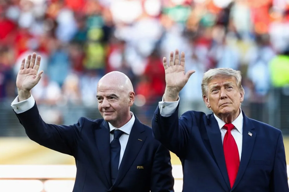 US President Donald Trump (R) and FIFA President Gianni Infantino (L) wave during the award ceremony of the 2026 World Cup football tournament final match between Spain and Argentina at the New York/New Jersey Stadium in East Rutherford on July 19, 2026. FRANCK FIFE / AFP