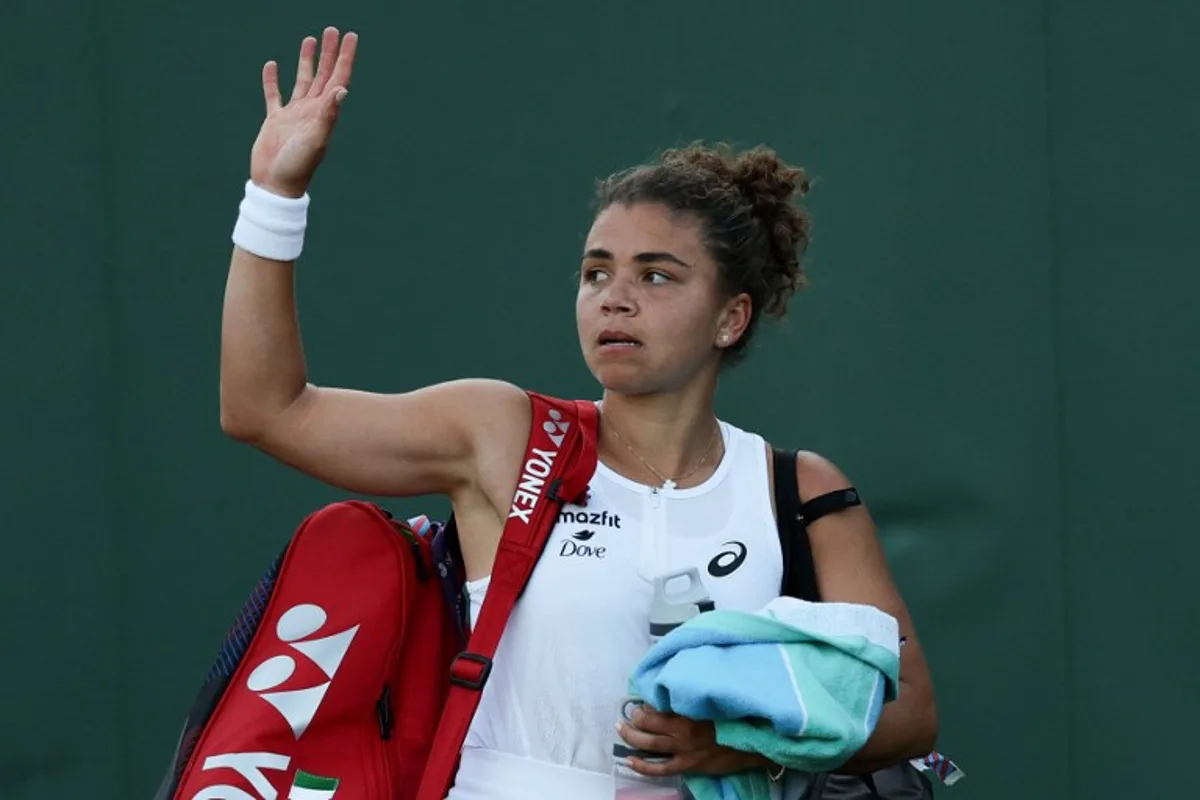 Italy's Jasmine Paolini leaves the court after losing against Russia's Kamilla Rakhimova at the end of their women's singles second round tennis match on the third day of the 2025 Wimbledon Championships at The All England Lawn Tennis and Croquet Club in Wimbledon, southwest London, on July 2, 2025. Adrian Dennis / AFP