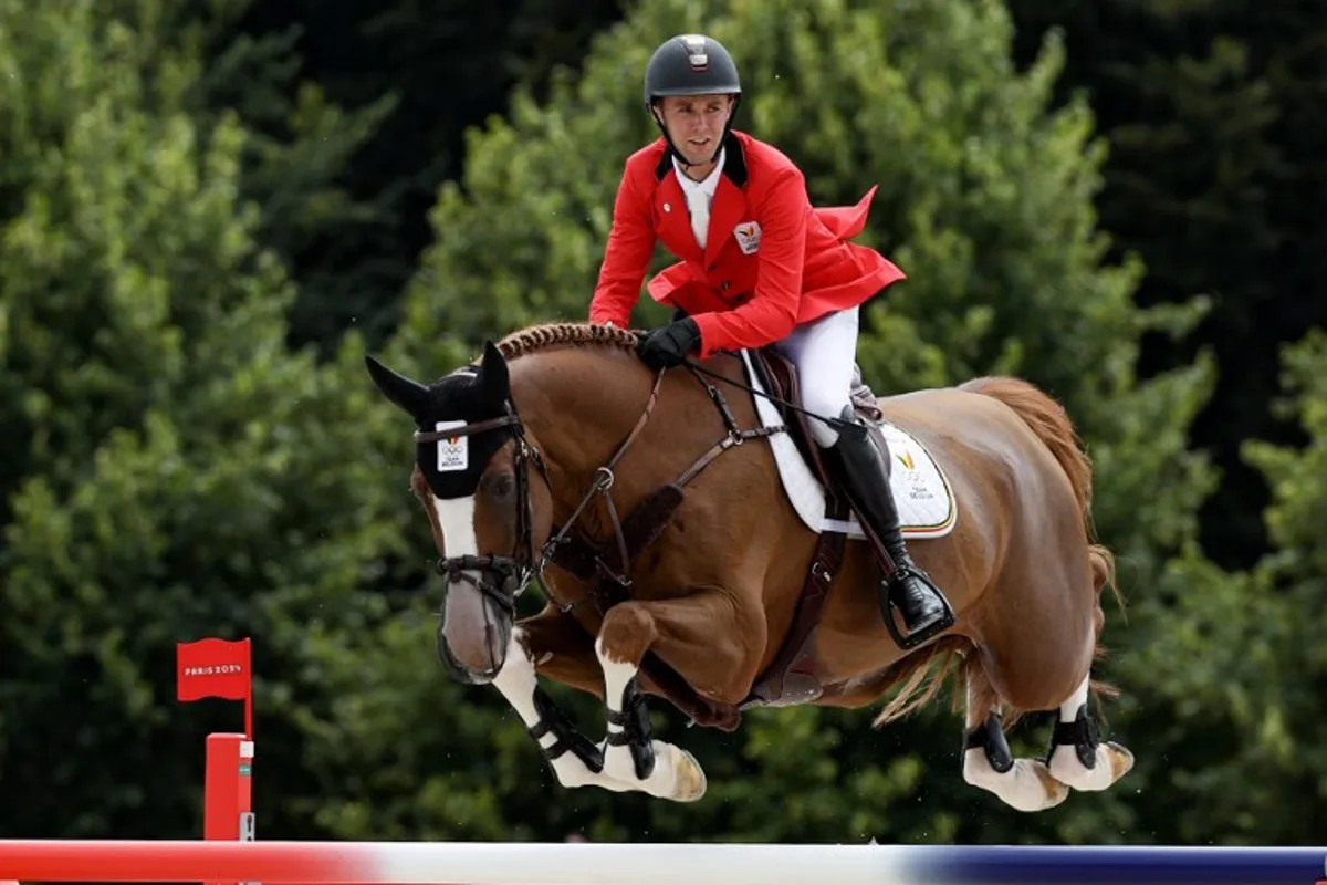 Belgium's Gilles Thomas with horse Ermitage Kalone competes in the equestrian's jumping team final during the Paris 2024 Olympic Games at the Chateau de Versailles, in Versailles, in the western outskirts of Paris, on August 2, 2024. Pierre-Philippe MARCOU / AFP