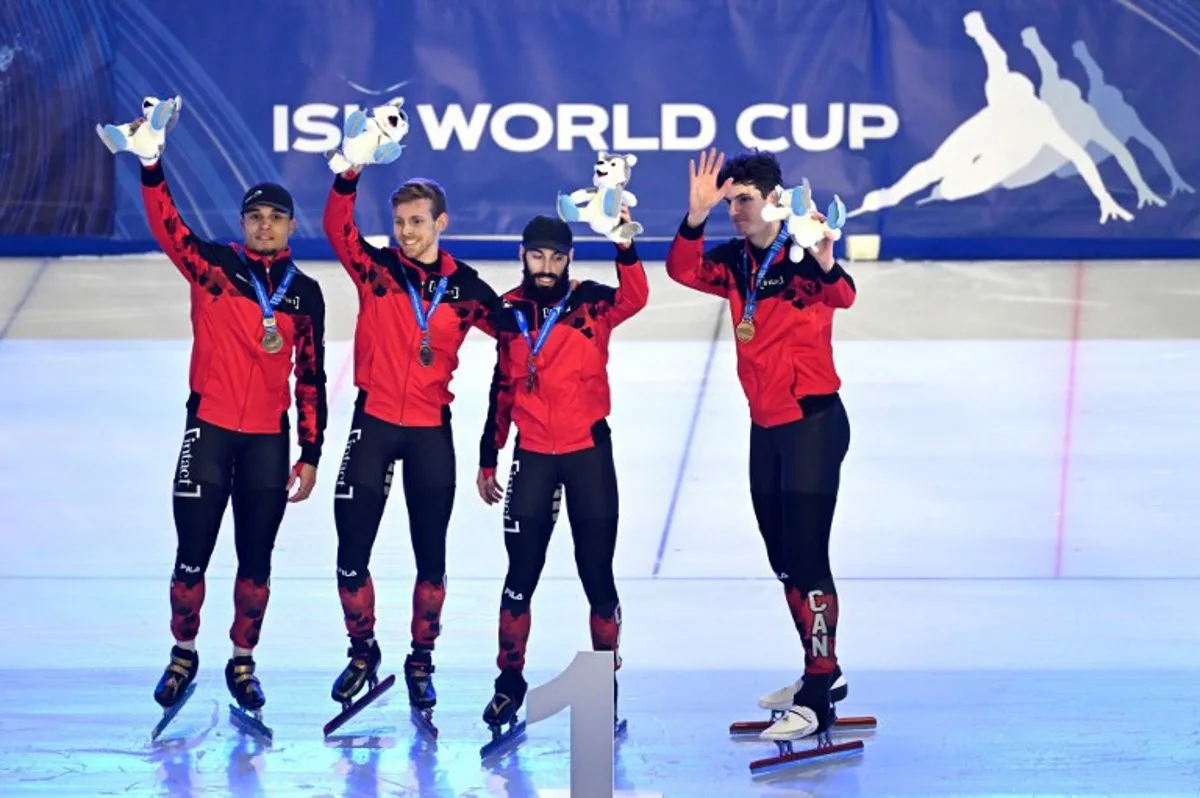 Gold medallist Canadian team celebrate during the medal ceremony after the men's 5000m Relay Finals at the ISU World Cup Short Track Speed Skating in Gdansk on February 18, 2024.  Sergei GAPON / AFP