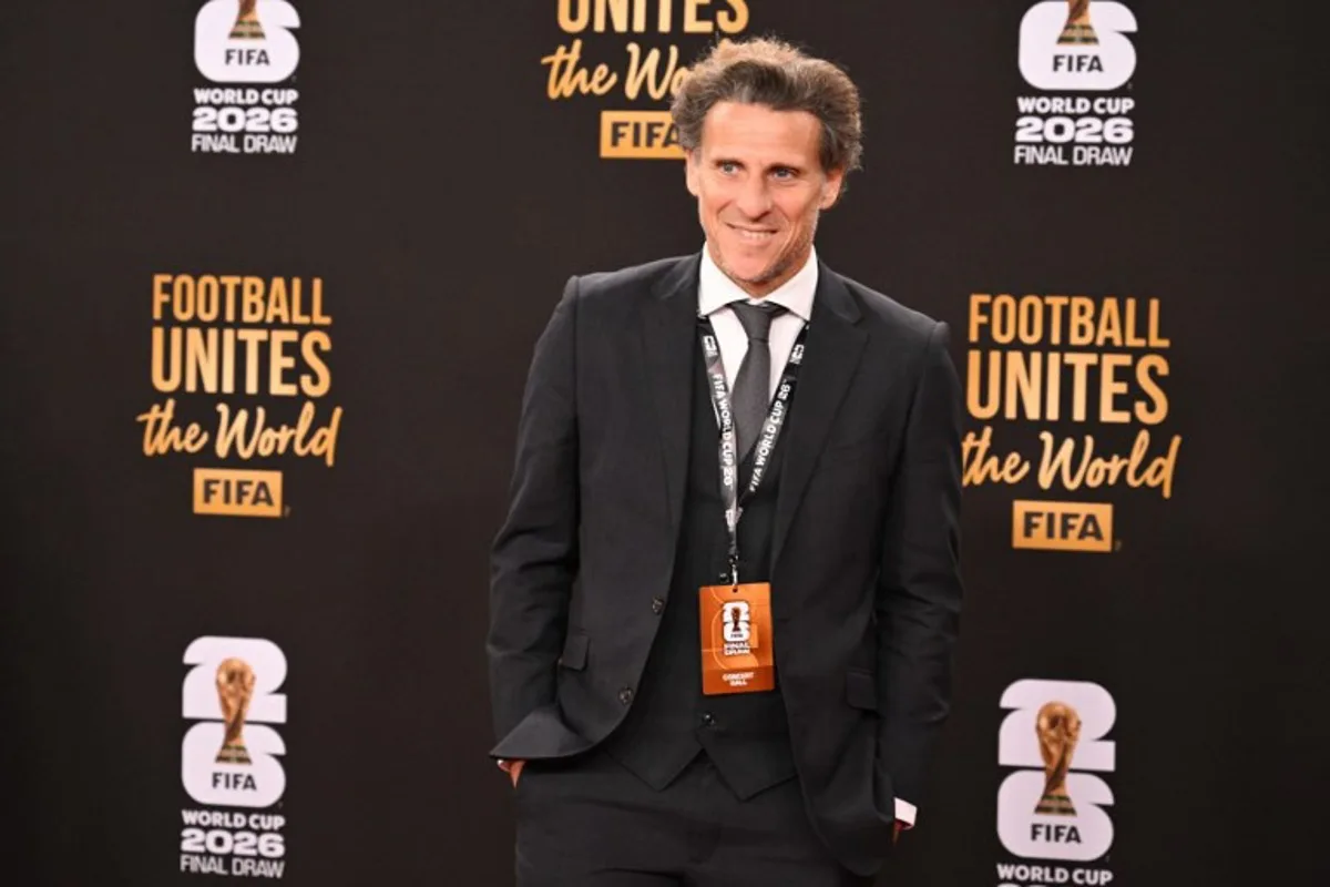 Uruguay's former player Diego Forlan poses on the red carpet upon arrival to attend the draw for the 2026 FIFA Football World Cup taking place in the US, Canada and Mexico, at the Kennedy Center, in Washington, DC, on December 5, 2025. Roberto SCHMIDT / AFP