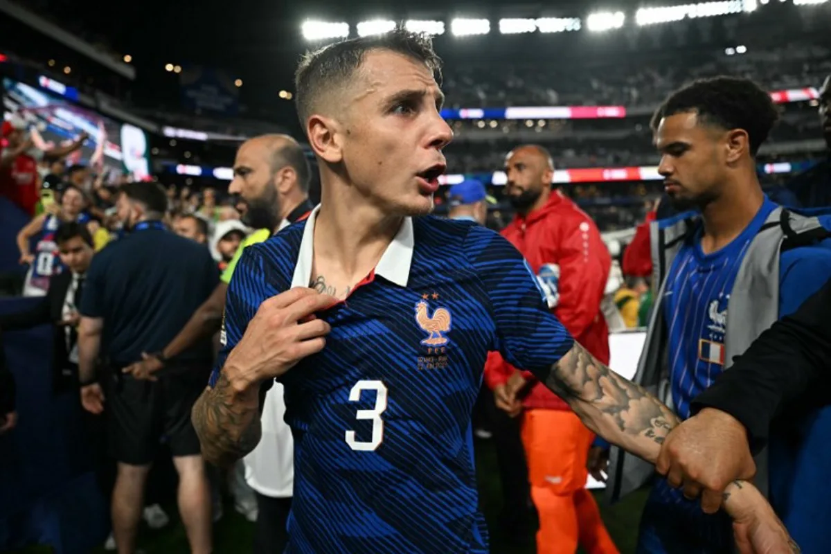 France's defender #03 Lucas Digne gestures as he leaves the pitch after winning the 2026 World Cup Group I football match between France and Iraq at the Philadelphia Stadium in Philadelphia on June 22, 2026. MAURO PIMENTEL / AFP