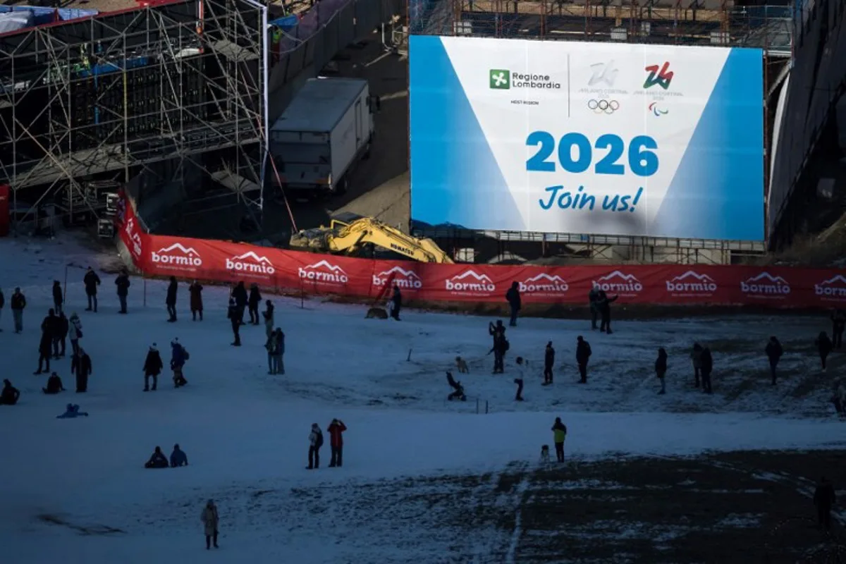 This photograph shows a banner displayed next to the arrival of the Olympic slope for the men's alpine events of the Milan Cortina 2026 Winter Olympics, prior to the Men's Super G race of the FIS Alpine ski World Cup 2024-2025, in Bormio on December 29, 2024.  Fabrice COFFRINI / AFP