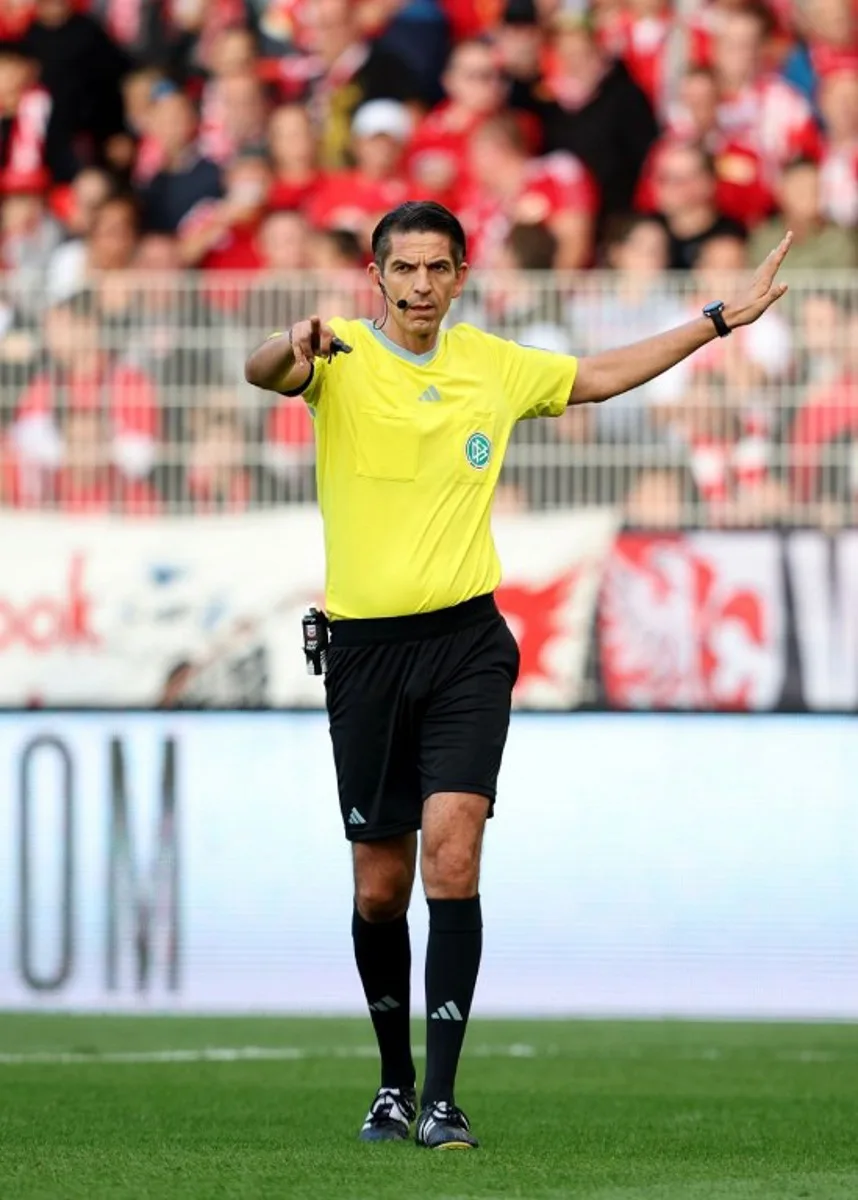 Referee Deniz Aytekin gestures during the German first division Bundesliga football match between Union Berlin and TSG 1899 Hoffenheim in Berlin, Germany, on September 23, 2023. Ronny HARTMANN / AFP