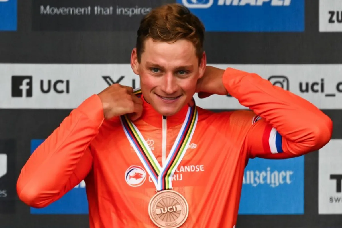 Third-placed Netherlands' Mathieu van der Poel celebrates during the podium ceremony of the men's Elite Road Race cycling event as part of the UCI 2024 Road World Championships, in Zurich, on September 29, 2024.  Fabrice COFFRINI / AFP