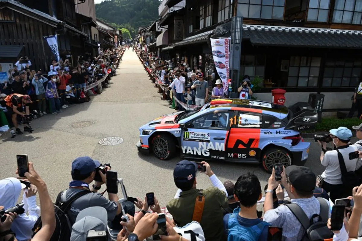 Thierry Neuville of Belgium and his co-driver Martijn Wydaeghe of Belgium drive their Hyundai i20 N Rally1 on the traditional Japanese townscape of Iwamura during the Rally Japan, the 7th round of the FIA World Rally Championships in Ena city, Gifu prefecture on May 30, 2026. Toshifumi KITAMURA / AFP