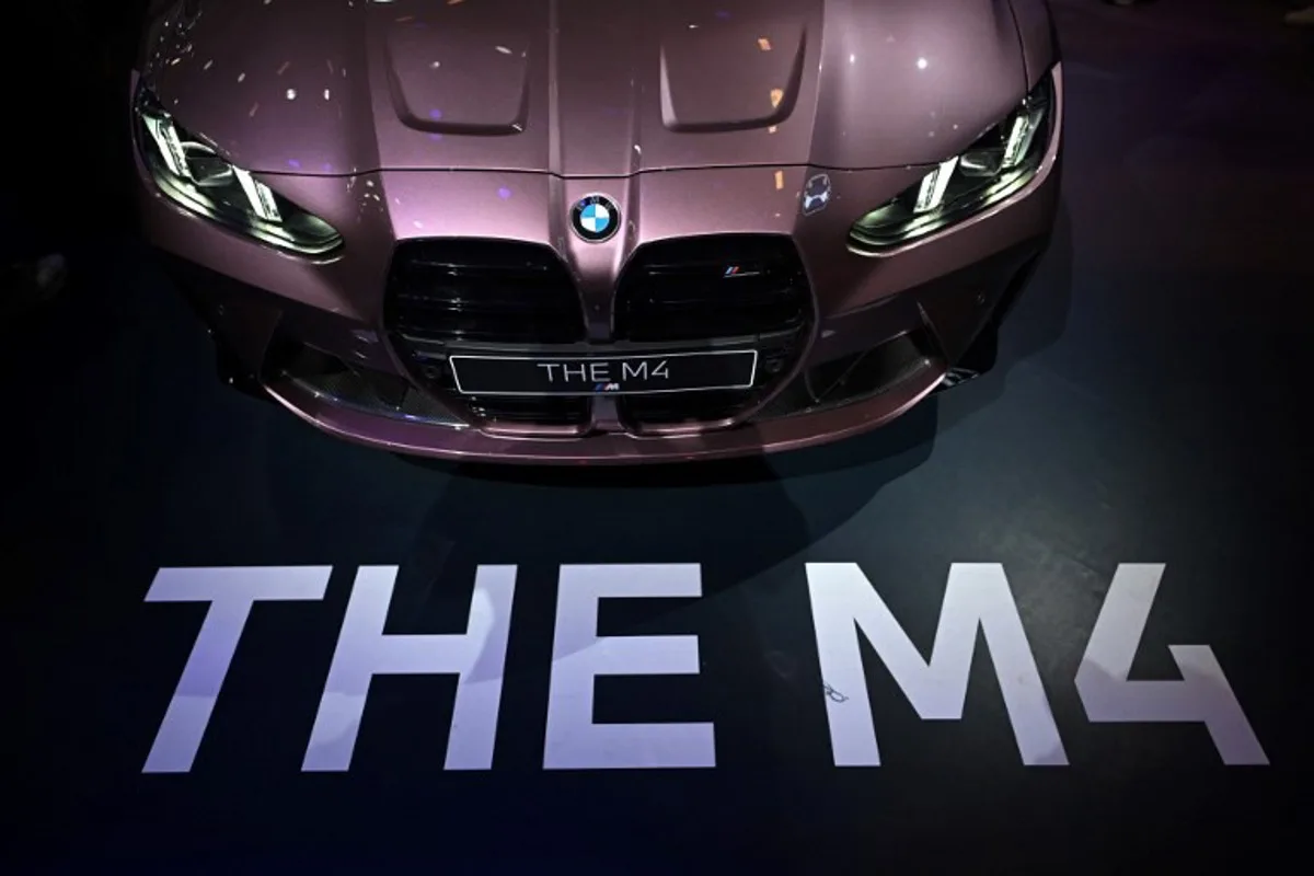 A BMW M4 is displayed at the Beijing Auto Show on April 29, 2024.  Pedro PARDO / AFP